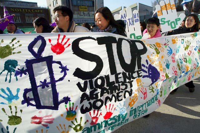 <p>File: South Korean women carry a banner in protest of violence against women during the Korea Women's Day  Festival</p>