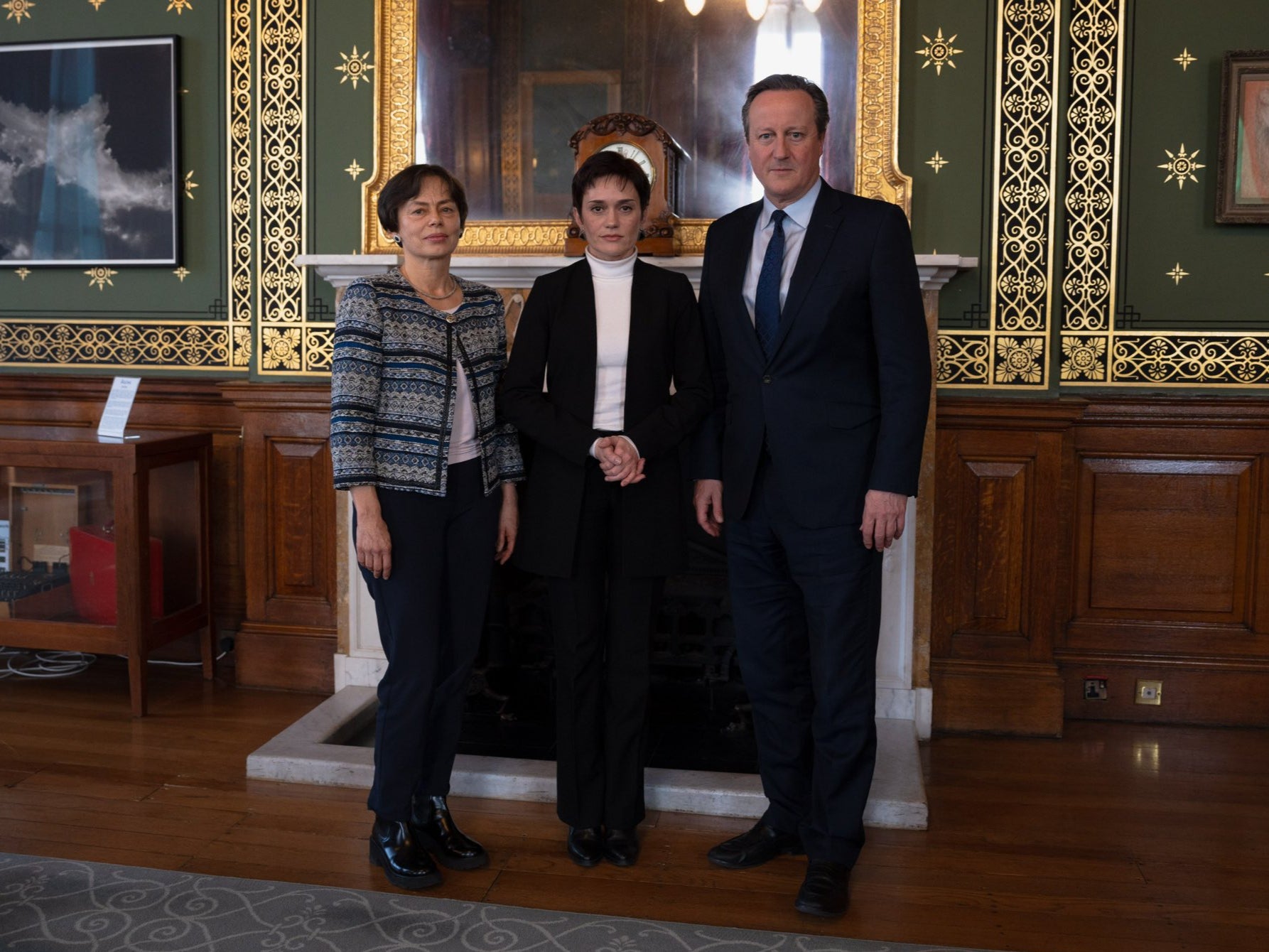 Elena Gordon, left, and Evgenia Kara-Murza, centre, stand with David Cameron during a meeting in March