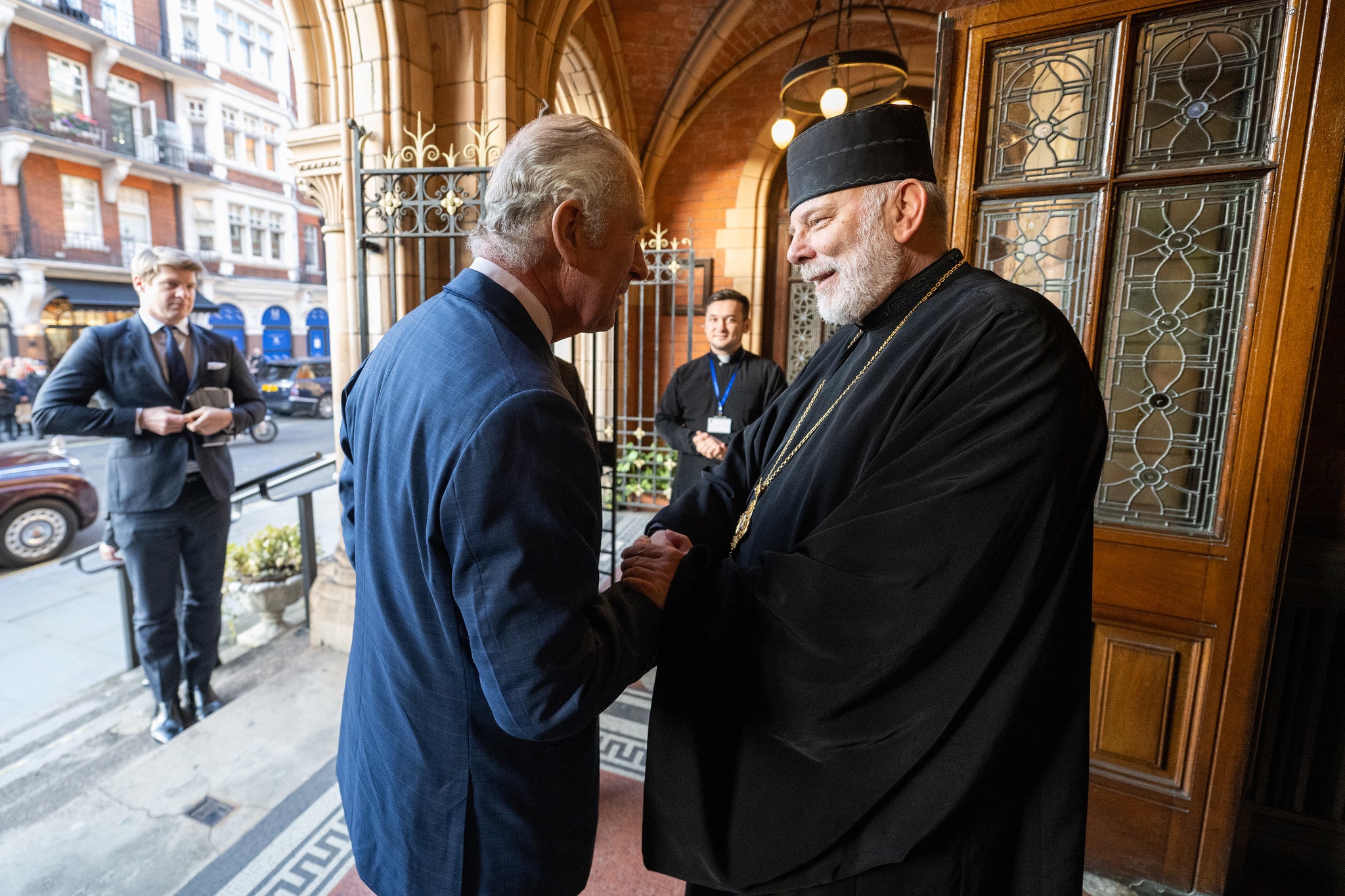 Bishop Kenneth Nowakowski with King Charles outside of his cathedral in London on Wednesday