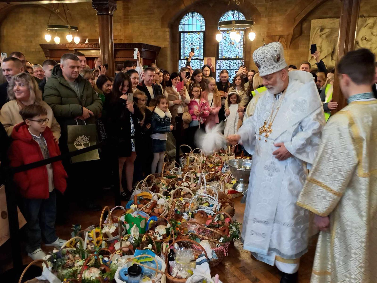 Crowds gather at the Cathedral of the Holy Family in central London for Easter