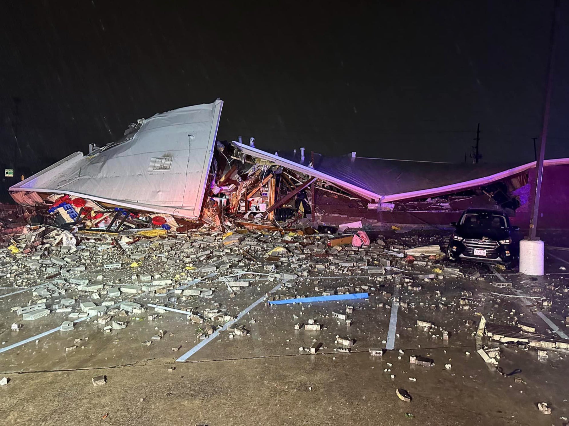 A building is reduced to rubble after severe storms hit Katy, Texas on 10 April