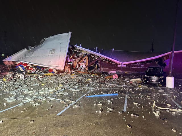 <p>A building is reduced to rubble after severe storms hit Katy, Texas on 10 April</p>
