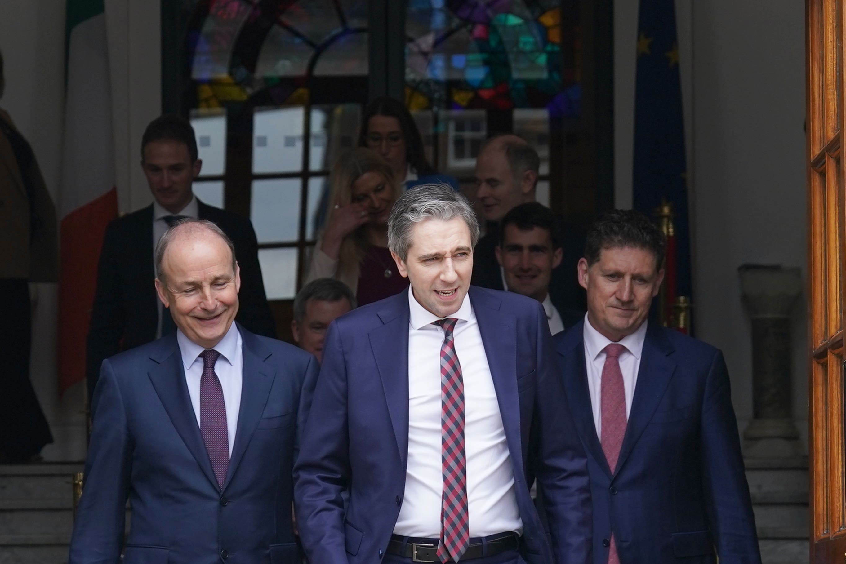 New Taoiseach Simon Harris (centre) with Tanaiste Micheal Martin (left) and Green Party Leader Eamon Ryan (right) (Brian Lawless/PA)