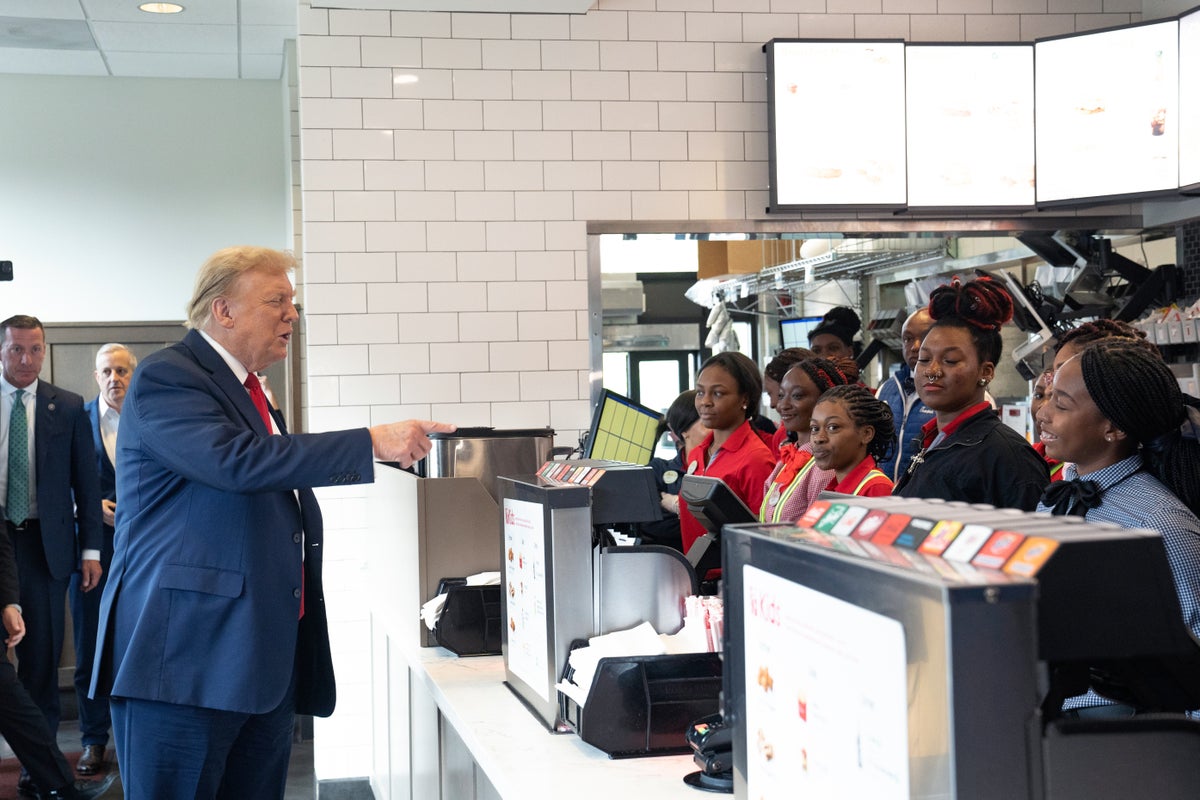 Trump indulges a hobby – handing out fast food – as he hits Chick-fil-A and orders lunch for customers