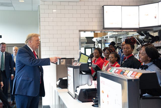 <p>Trump indulges one of his hobbies – handing out fast food - as he hits a Chick-fil-A and buys lunch for fans</p>