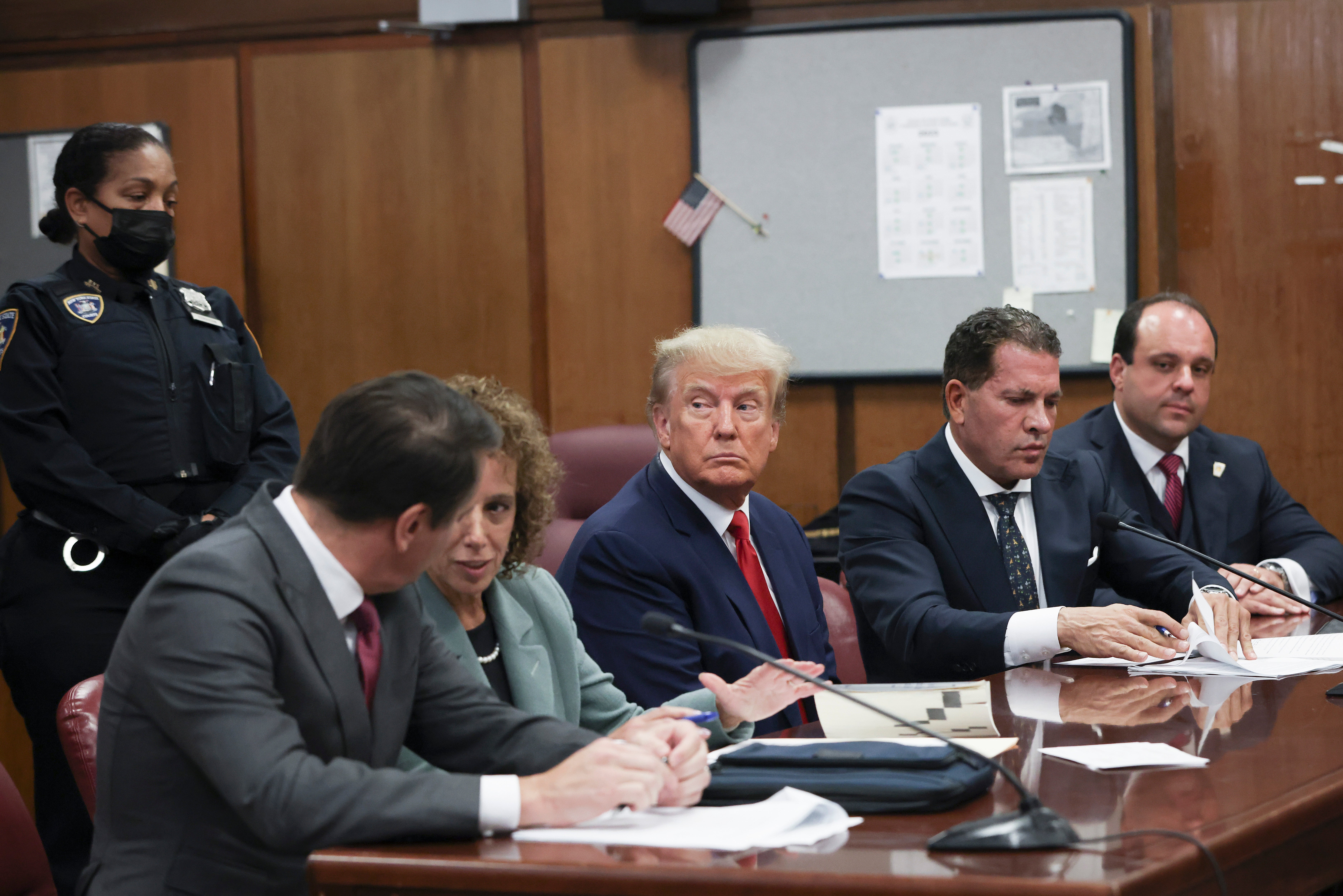 Trump sits in the courtroom with his attorneys during his arraignment at the Manhattan Criminal Court on 4 April 2023