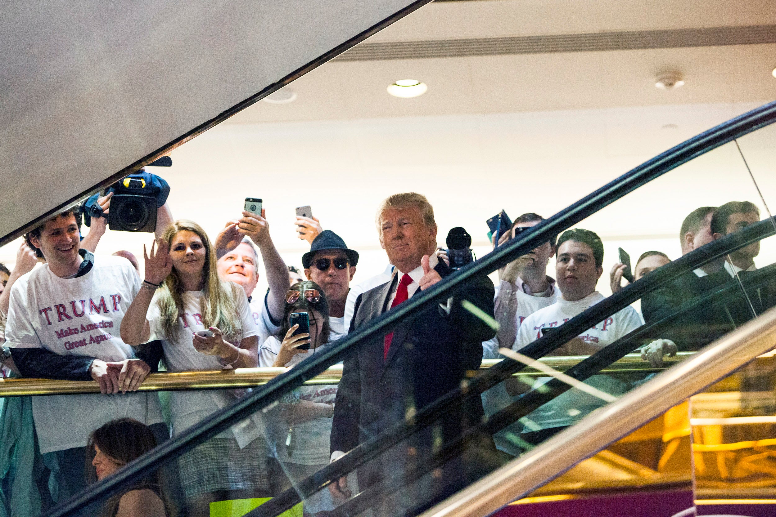 Donald Trump rides down a golden escalator in his New York skyscraper to a press event announcing his candidacy for the presidency on 16 June 2015