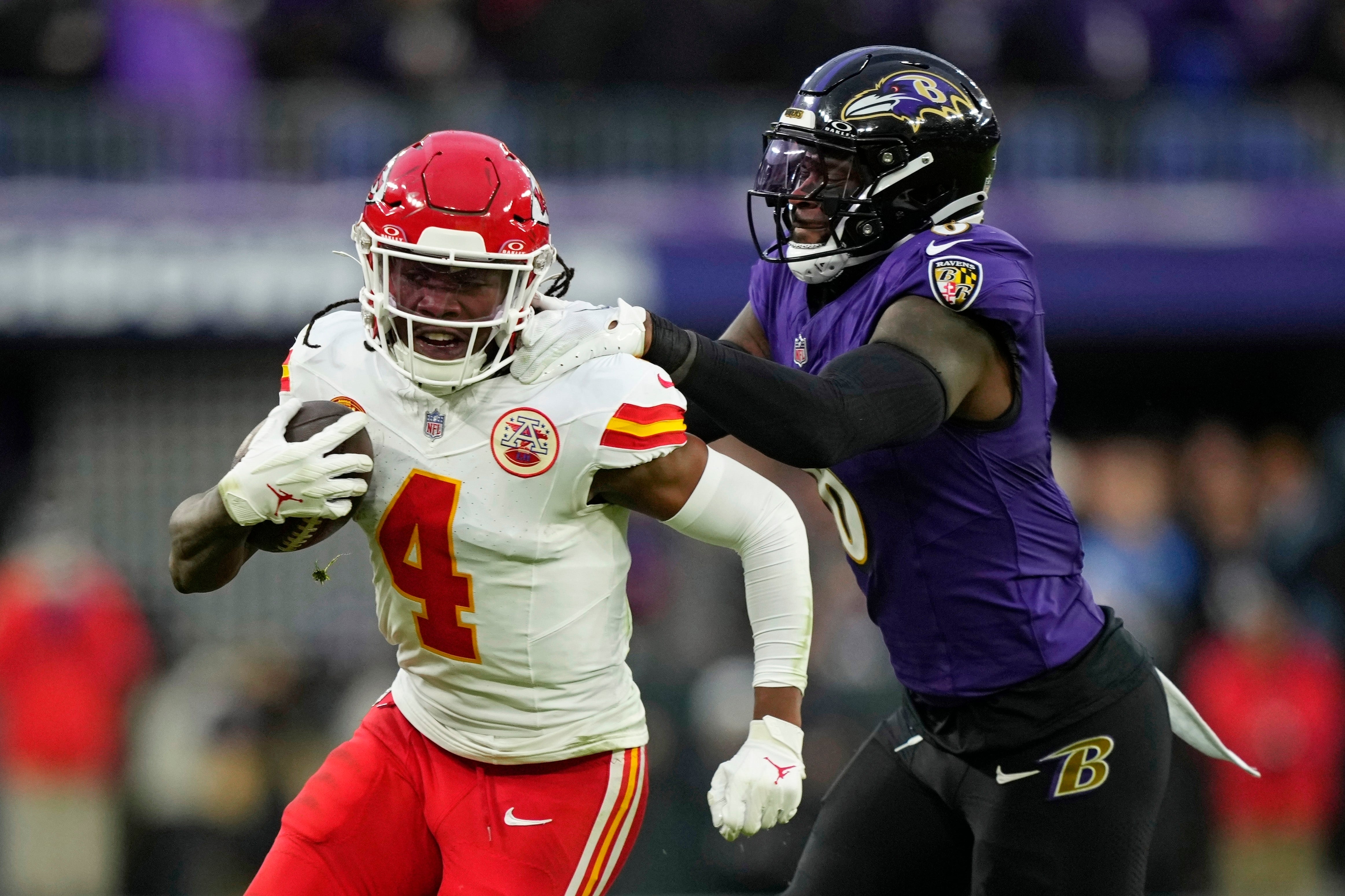 Kansas City Chiefs wide receiver Rashee Rice (4) is tackled by Baltimore Ravens linebacker Patrick Queen (6)