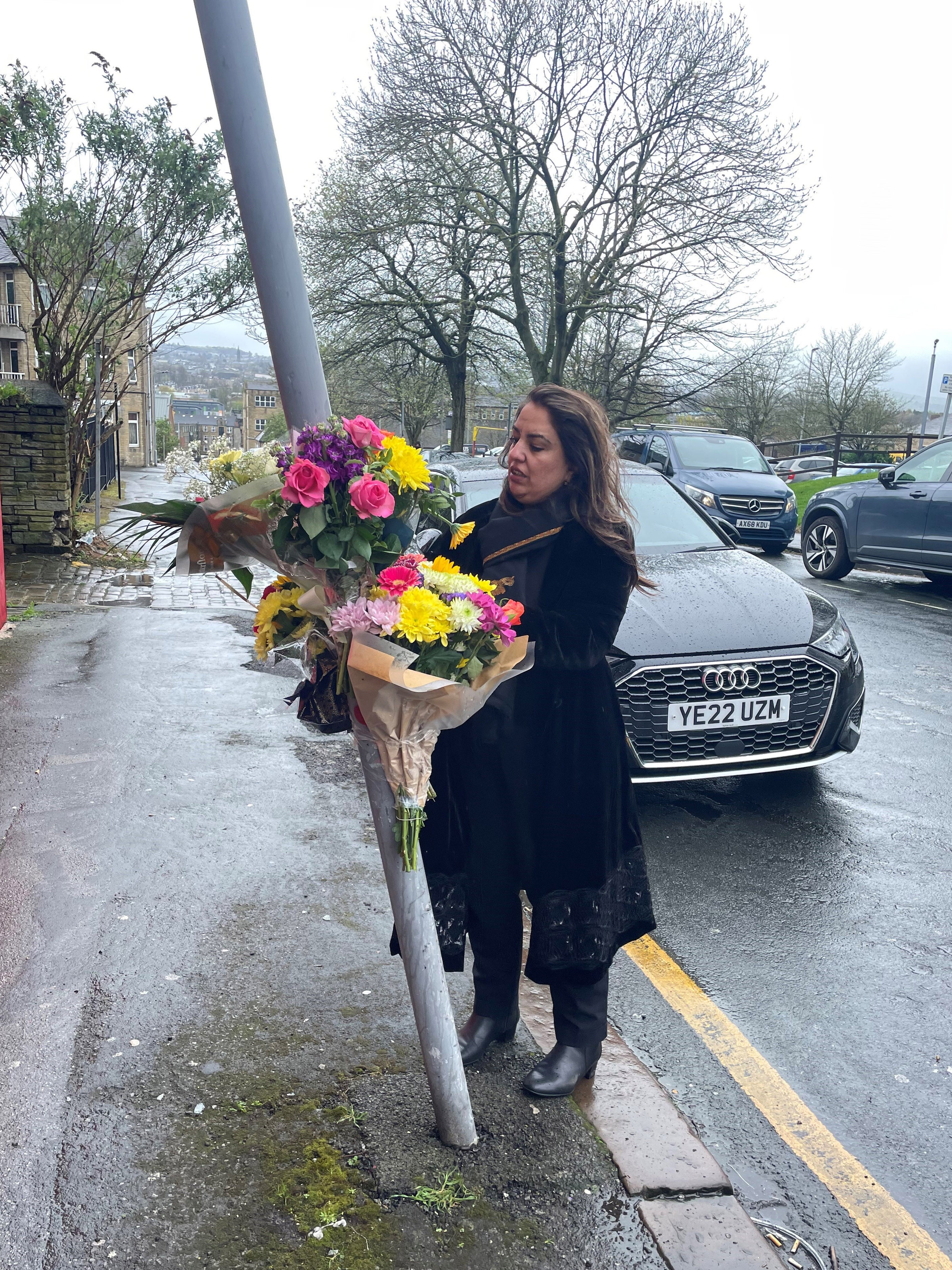 Labour MP Naz Shah lays flowers at the scene in Westgate, Bradford
