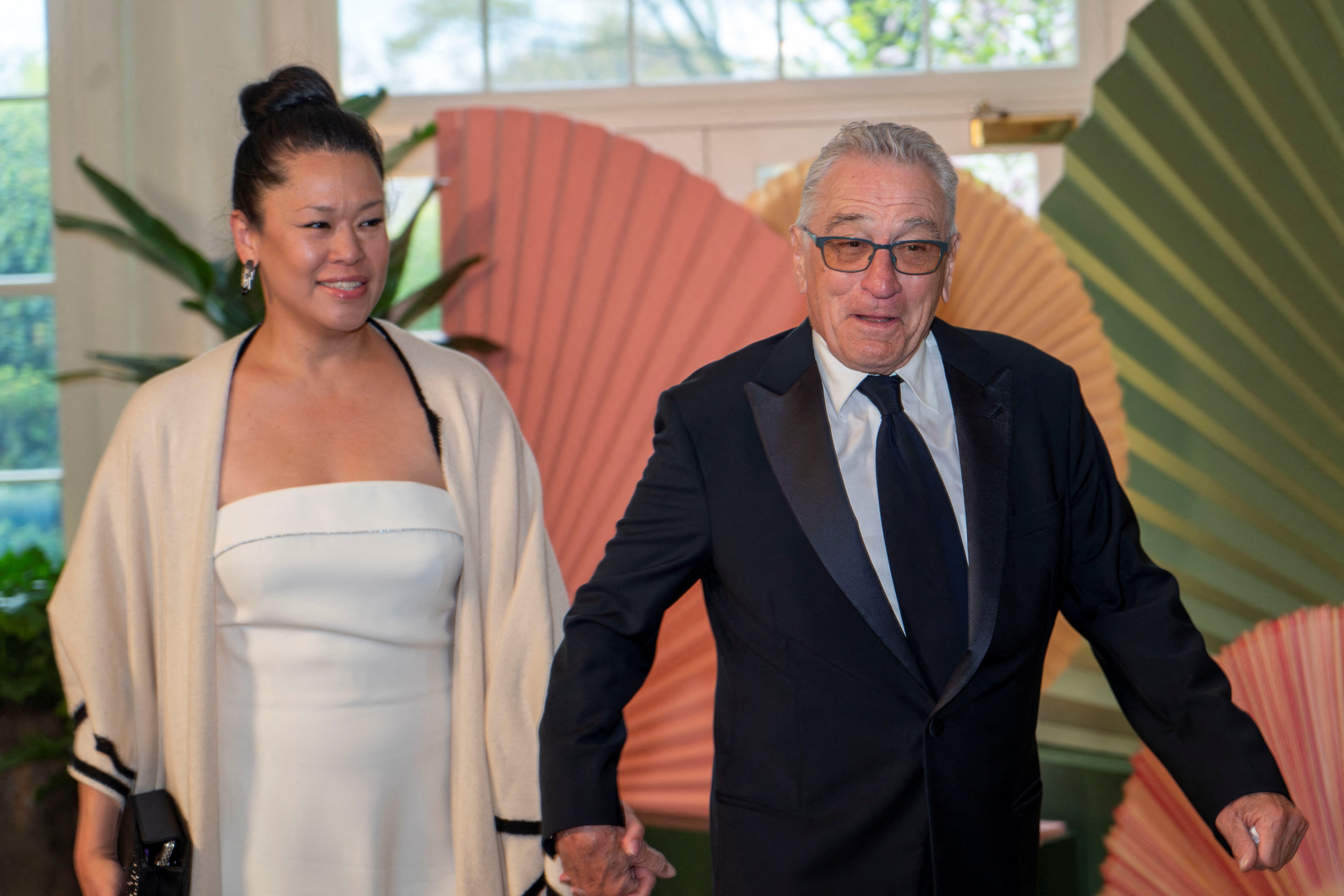Hollywood actor and outspoken Mr Trump critic De Niro arrived hand in hand with his girlfriend, Tiffany Chen