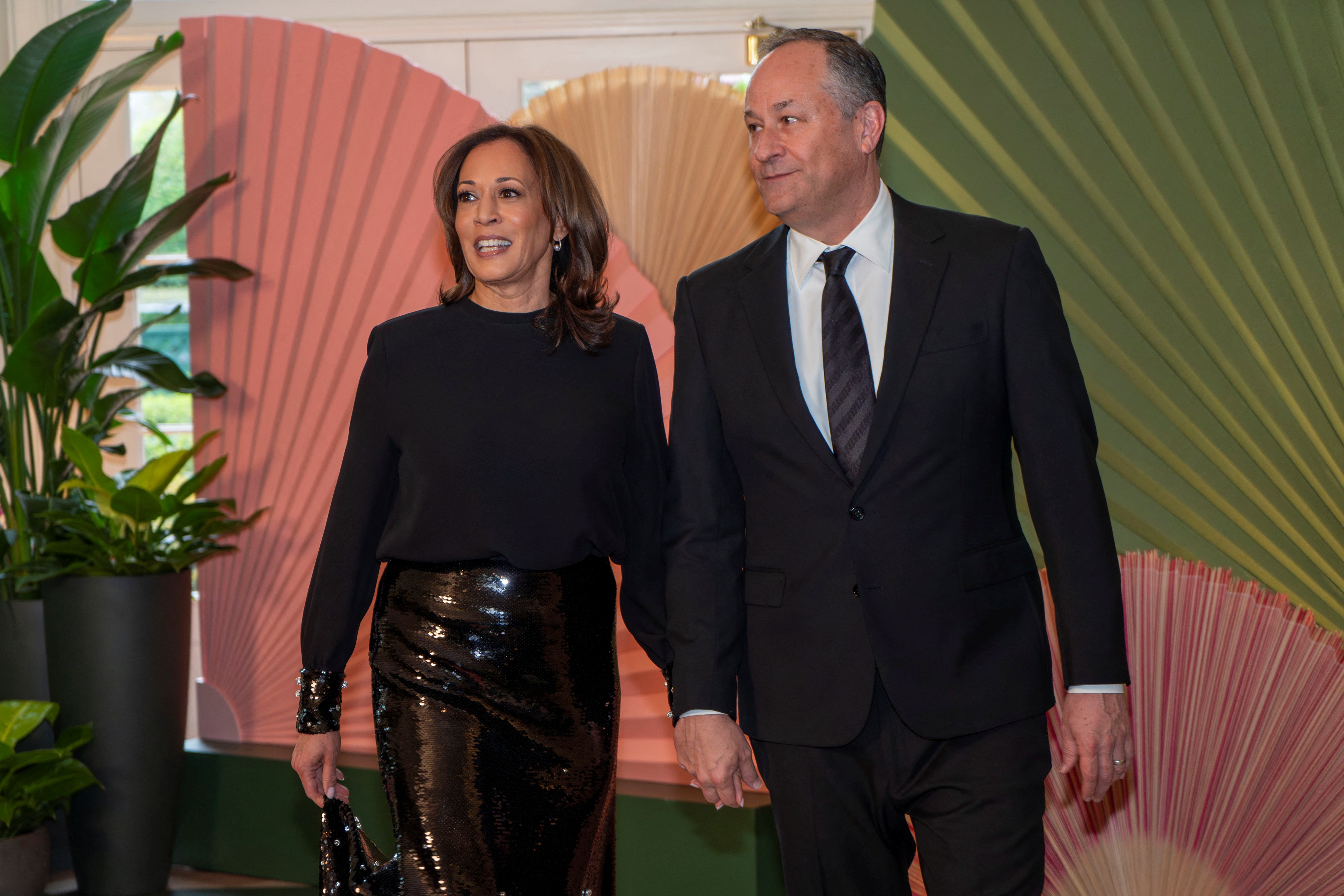 Harris and her husband, second gentleman Doug Emhoff, arrive for a state dinner earlier this year