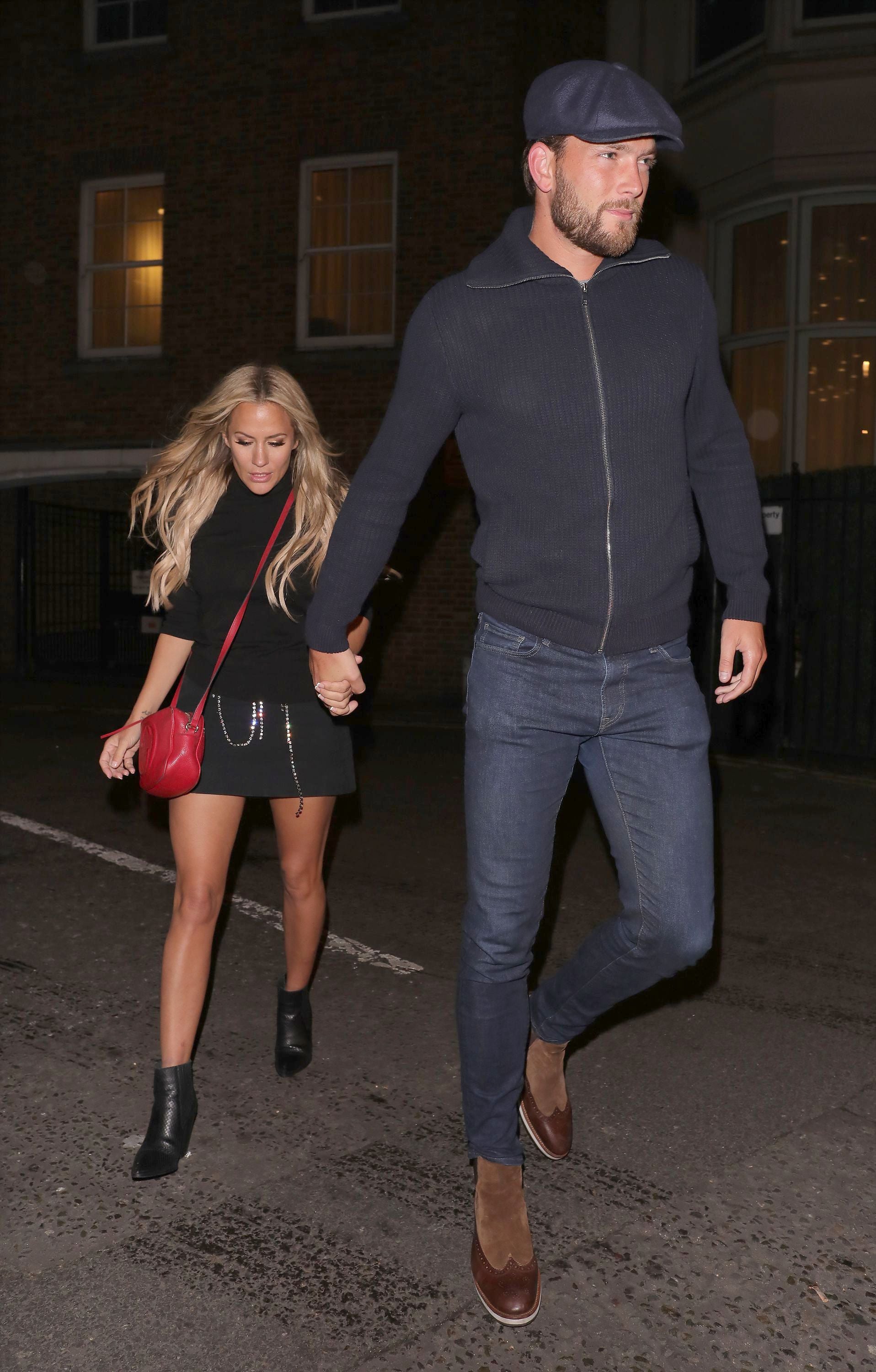 Caroline Flack and partner Lewis Burton leaving a restaurant