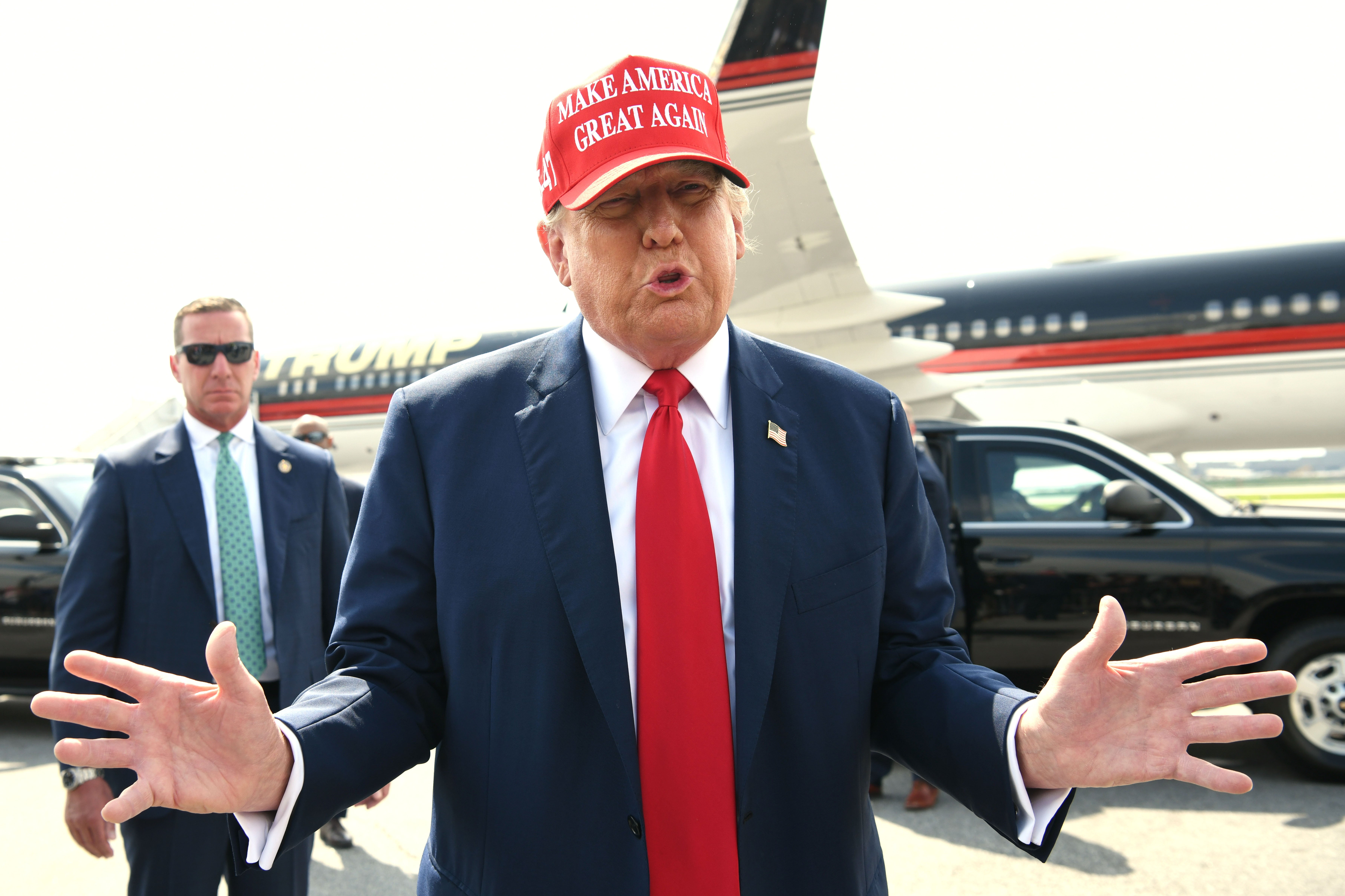 Donald Trump speaks to reporters on the campaign trail this week