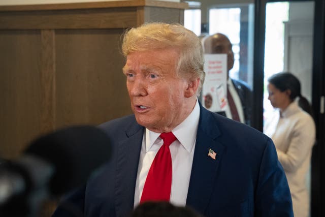 <p>Donald Trump speaks to the media during a visit to a Chick-fil-A restaurant on 10 April 2024 in Atlanta, Georgia</p>