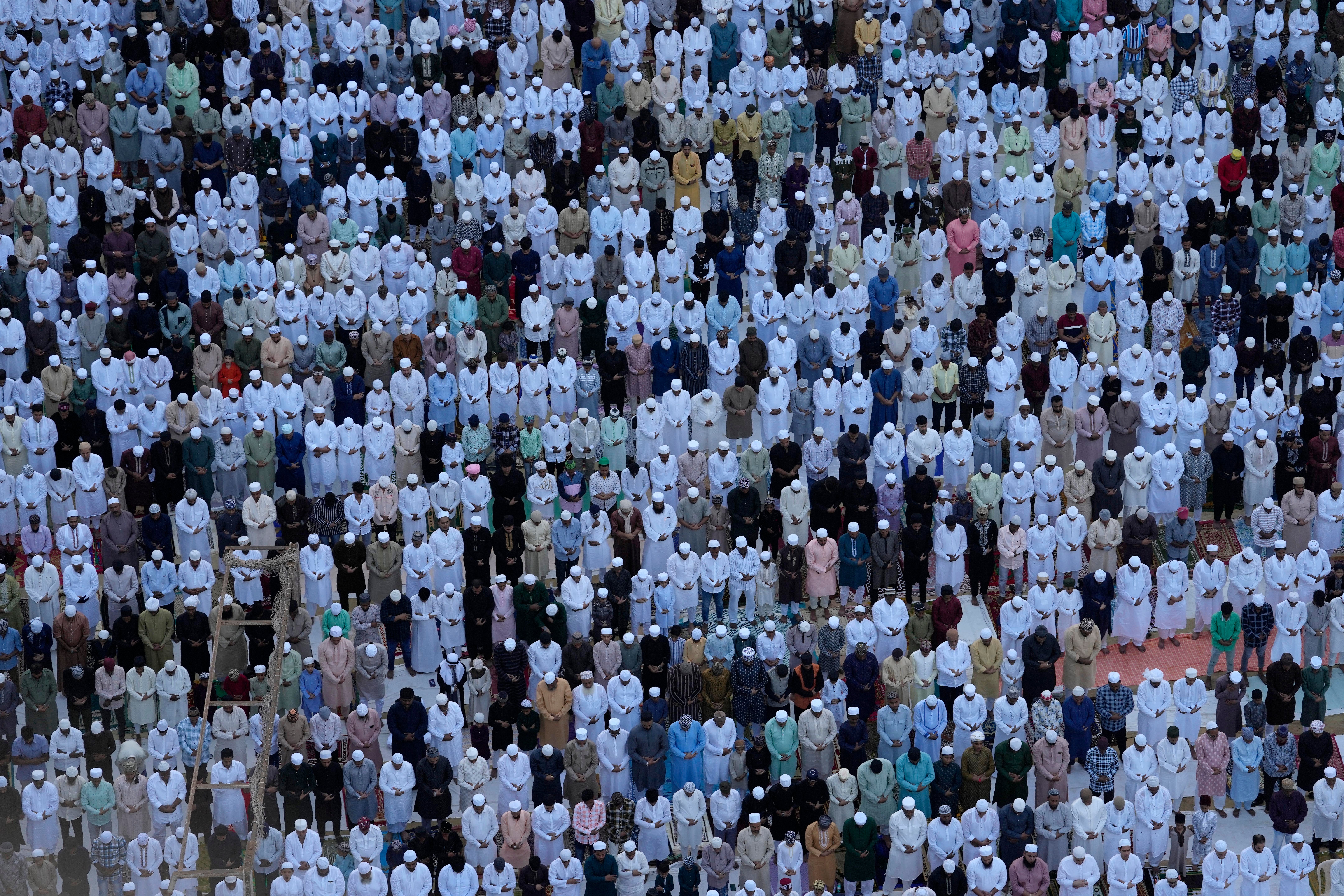 Muslims offer Eid prayers marking the end of the fasting month of Ramadan in Mumbai, India