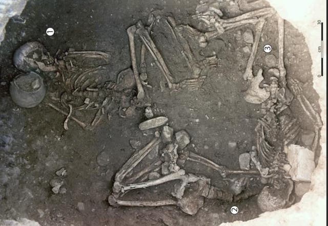 <p>View taken from the upper part of the 255 storage pit showing the three skeletons, with one individual in a central position (Woman 256 1) and the other two placed under the overhang of the wall (Woman 2 and Woman 3)</p>