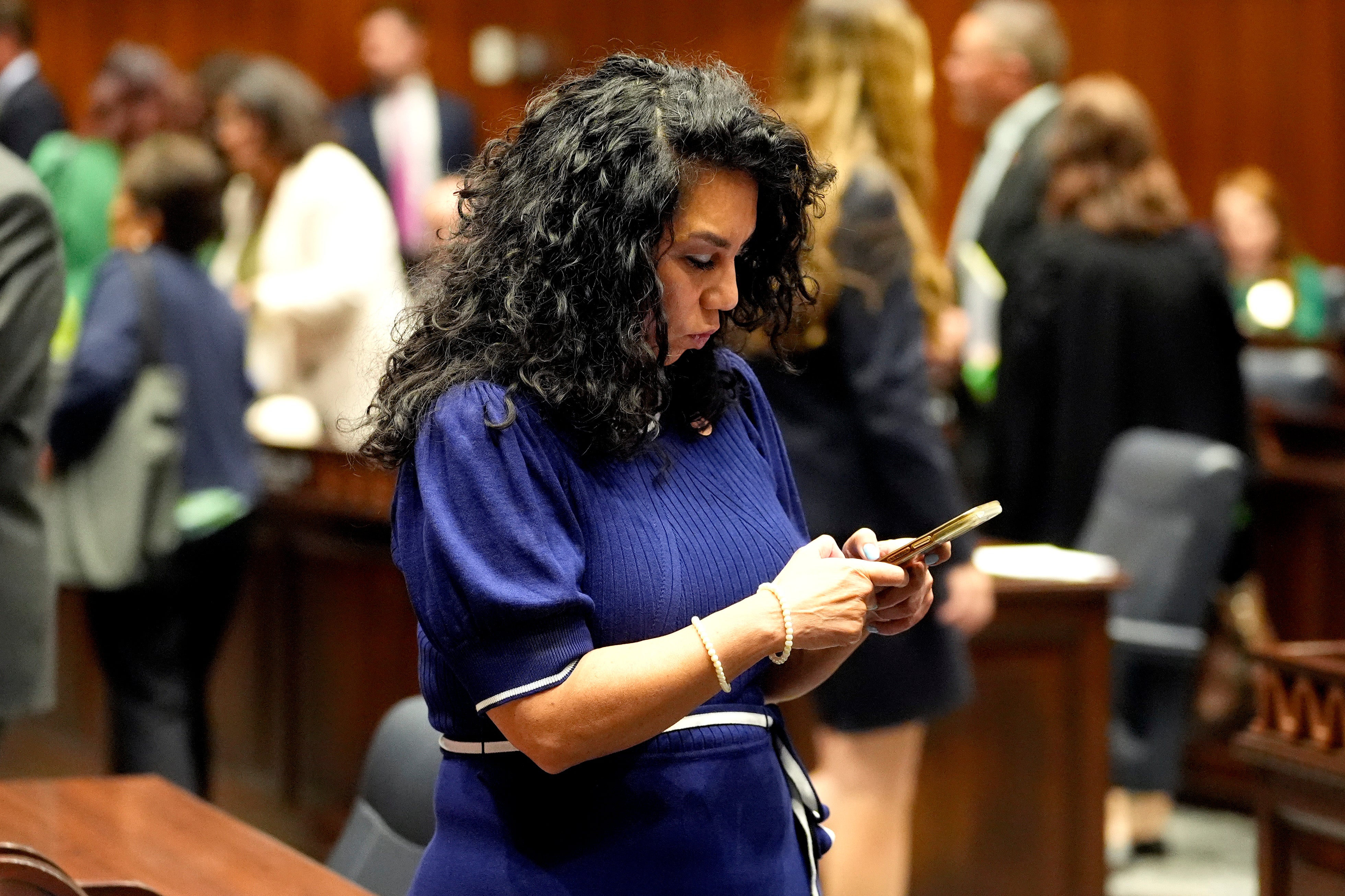 Arizona State Rep Teresa Martinez texts on House floor at the Capitol