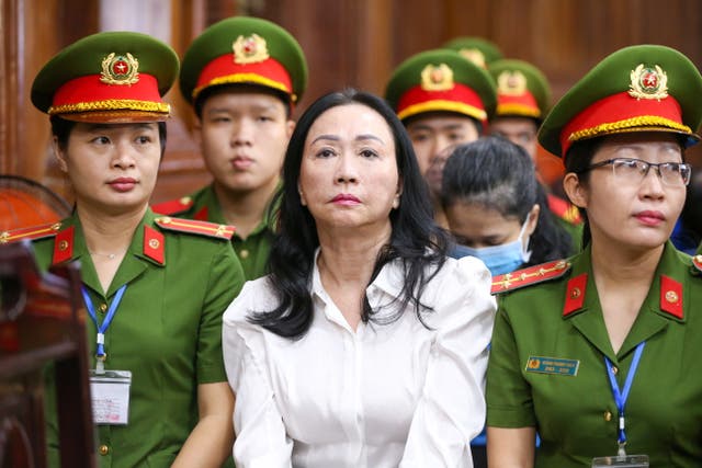 <p>Truong My Lan, centre, chair of Van Thinh Phat Holdings, sits during her trial at in Ho Chi Minh City</p>