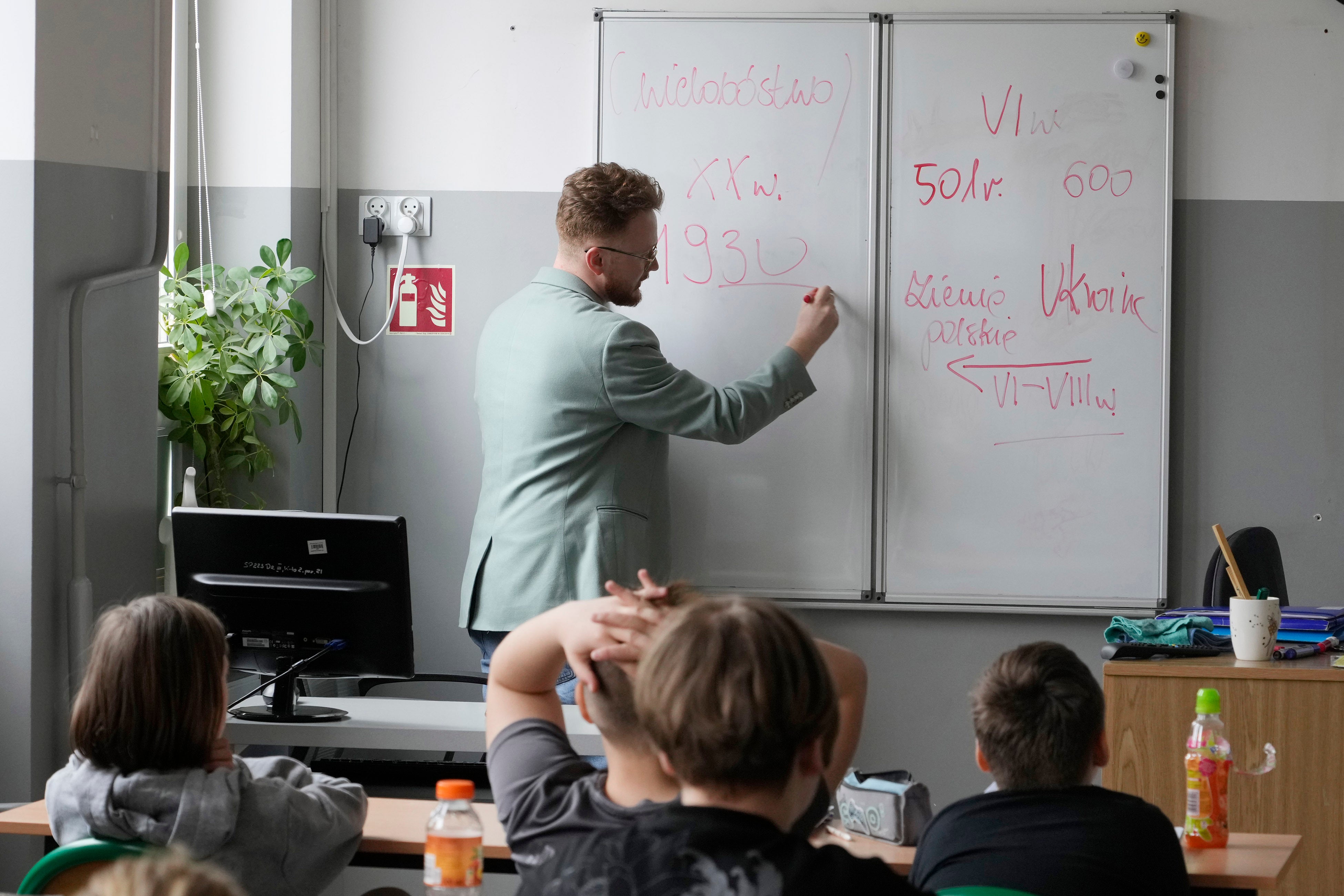 Arkadiusz Korporowicz teaches history to 5th grade children at Primary School number 223 in Warsaw, Poland