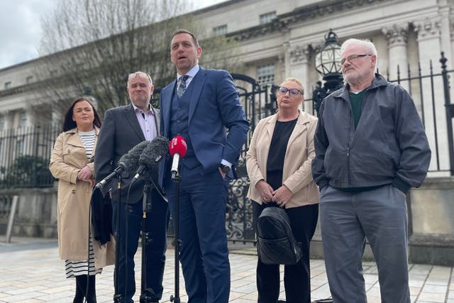 Solicitor Padraig O Muirigh (centre) with members of the families of Peter (known as Michael) Ryan and Tony Doris, two of the three men killed by the SAS during an incident at Coagh, Co Tyrone in June 1991 (Rebecca Black/PA)