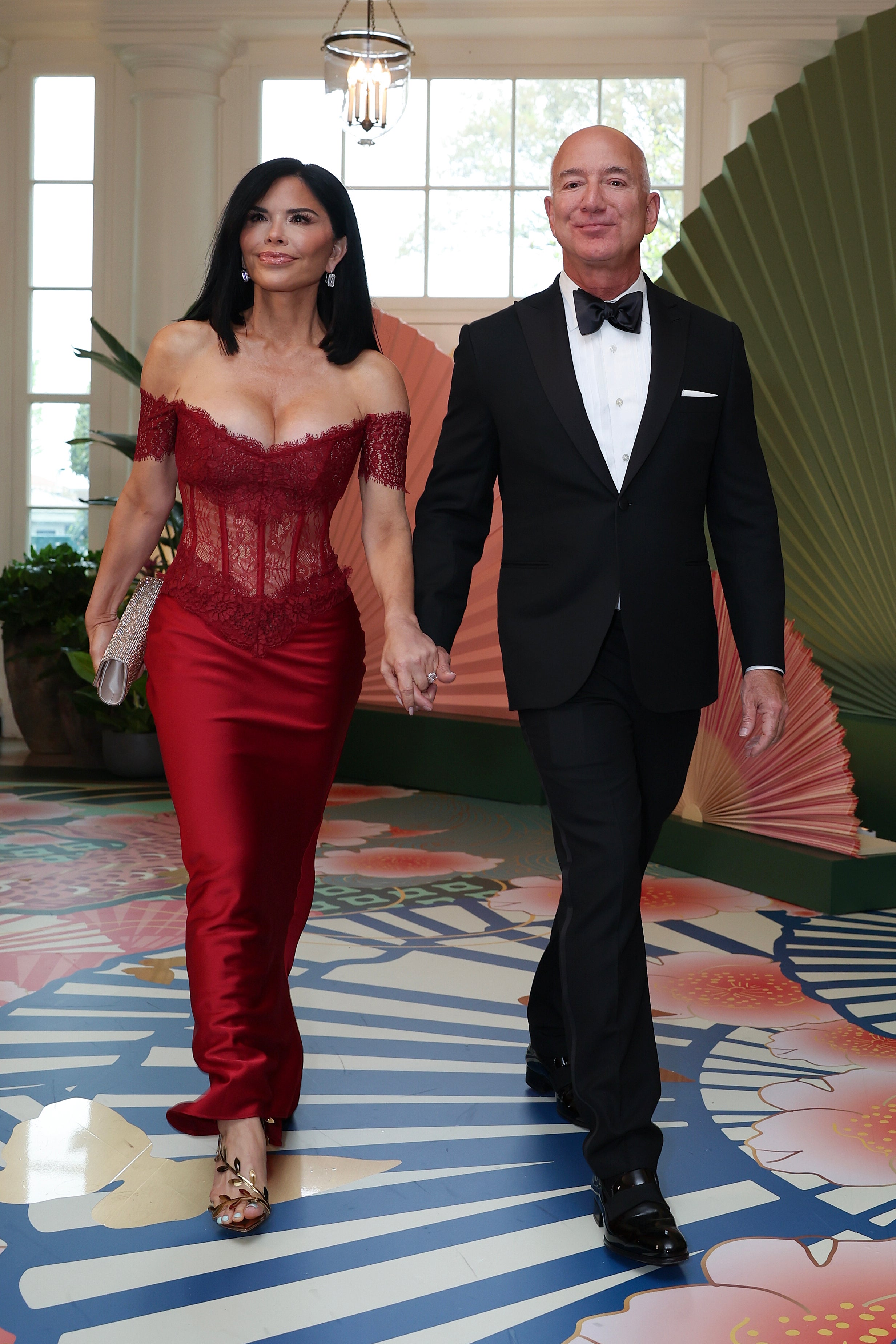 Jeff Bezos and his fiancee Lauren Sanchez arrive at the White House for the state dinner