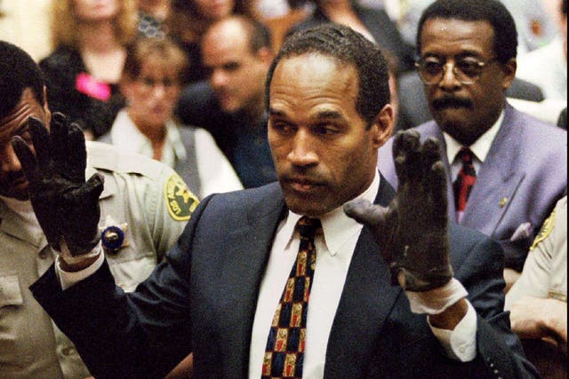 <p>O.J. Simpson, wearing the blood stained gloves found by Los Angeles Police and entered into evidence in Simpson's murder trial</p>