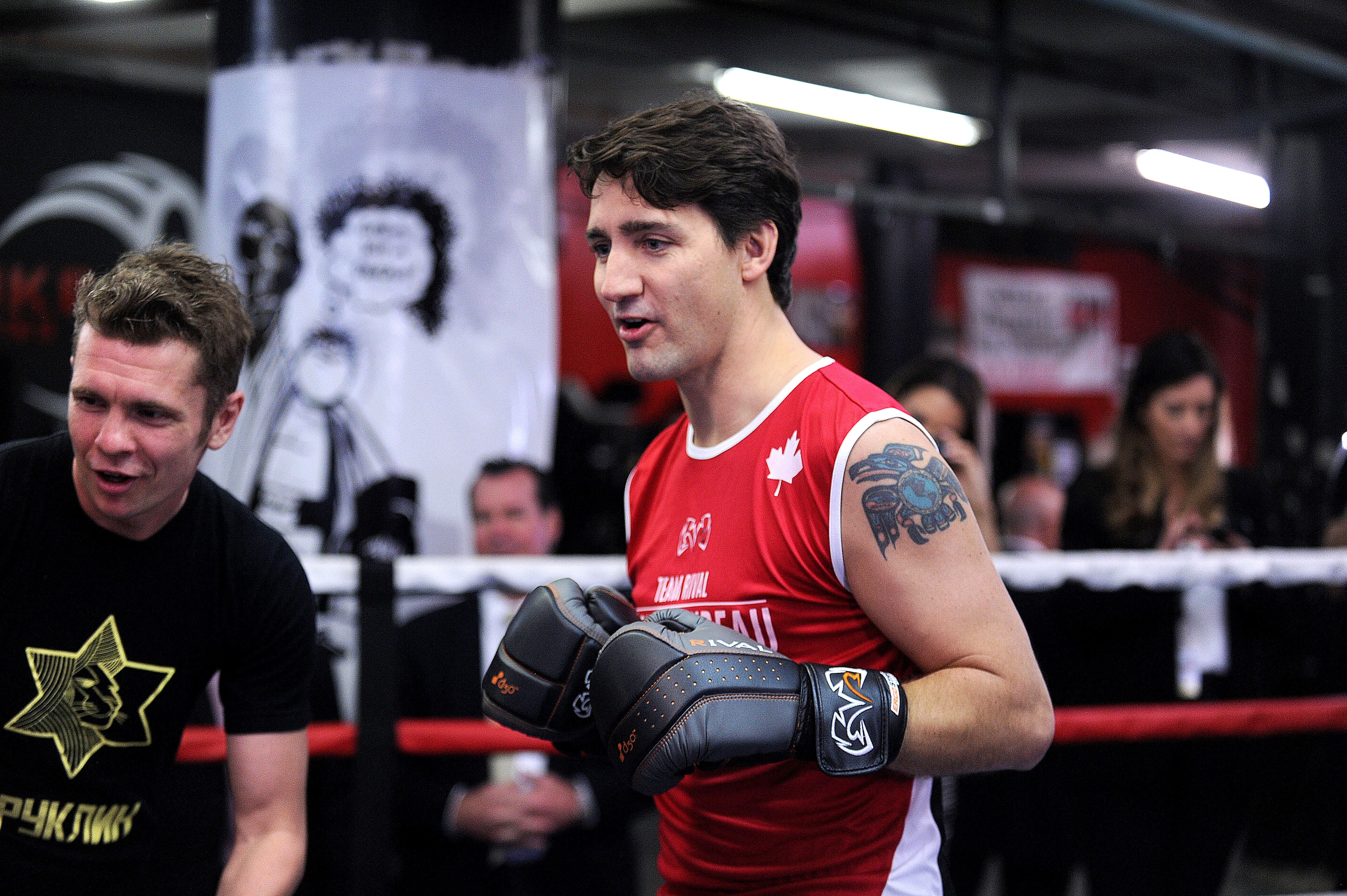 A young Justin Trudeau with his raven tat