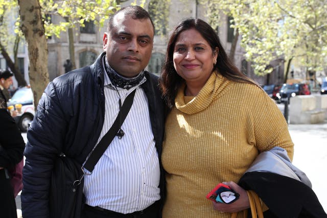 <p>Seema Misra with her husband Davinder outside the Royal Courts of Justice in 2021 (Yui Mok/PA)</p>