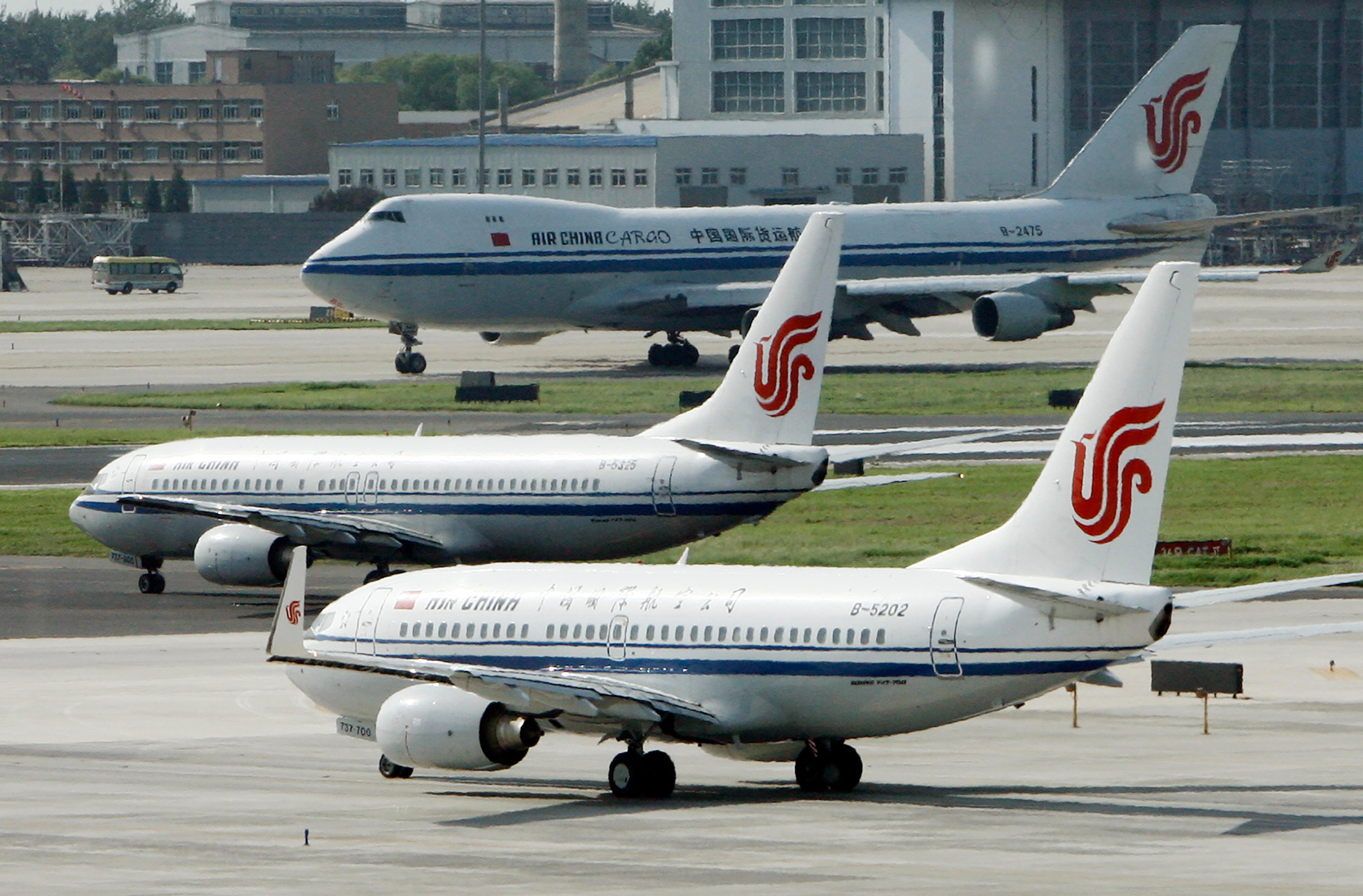 Air China planes sit on the tarmac at Beijing Airport in Beijing, China on Aug. 20, 2009