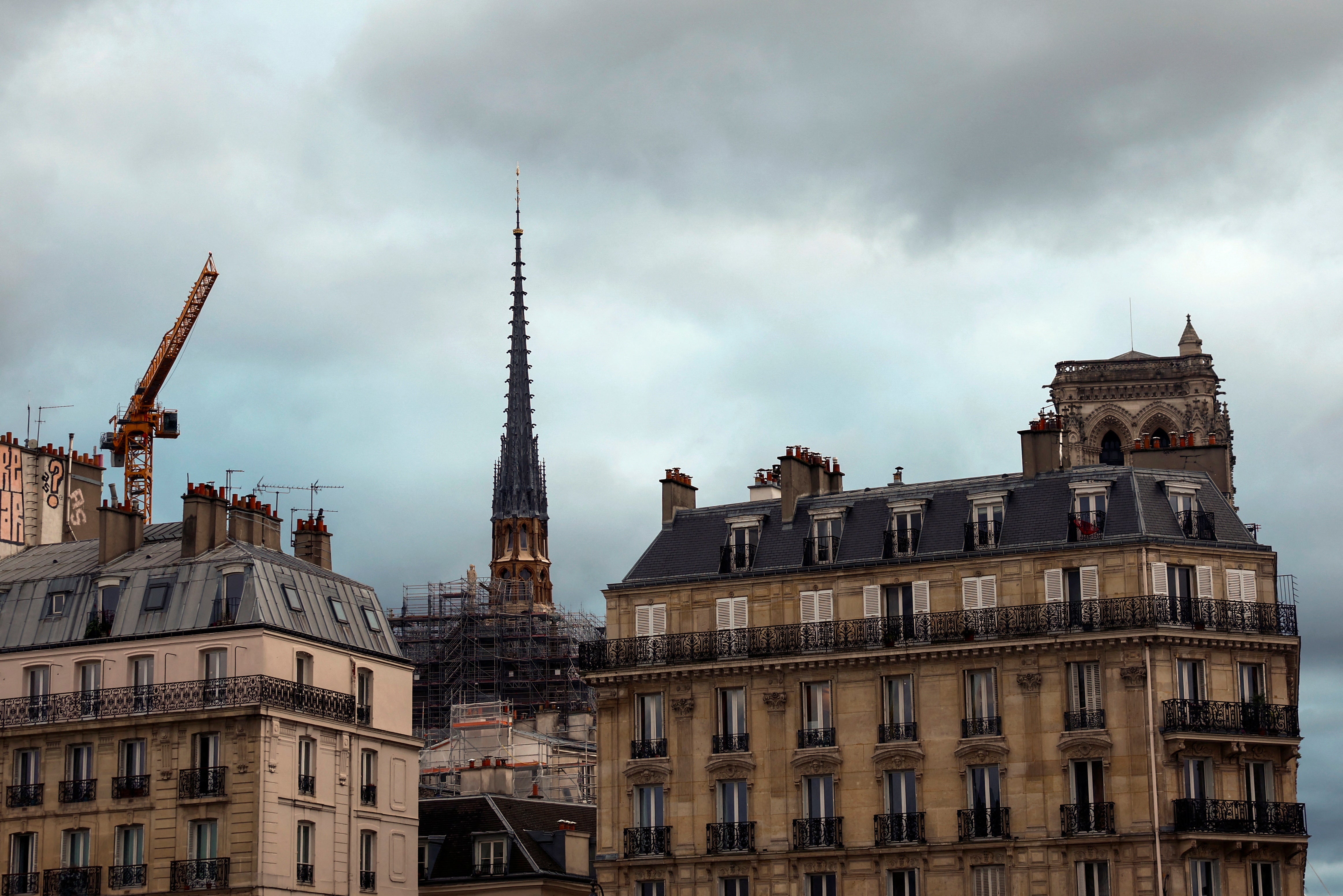 A view shows the new spire, surmounted by the rooster and the cross, of the Notre-Dame de Paris Cathedral