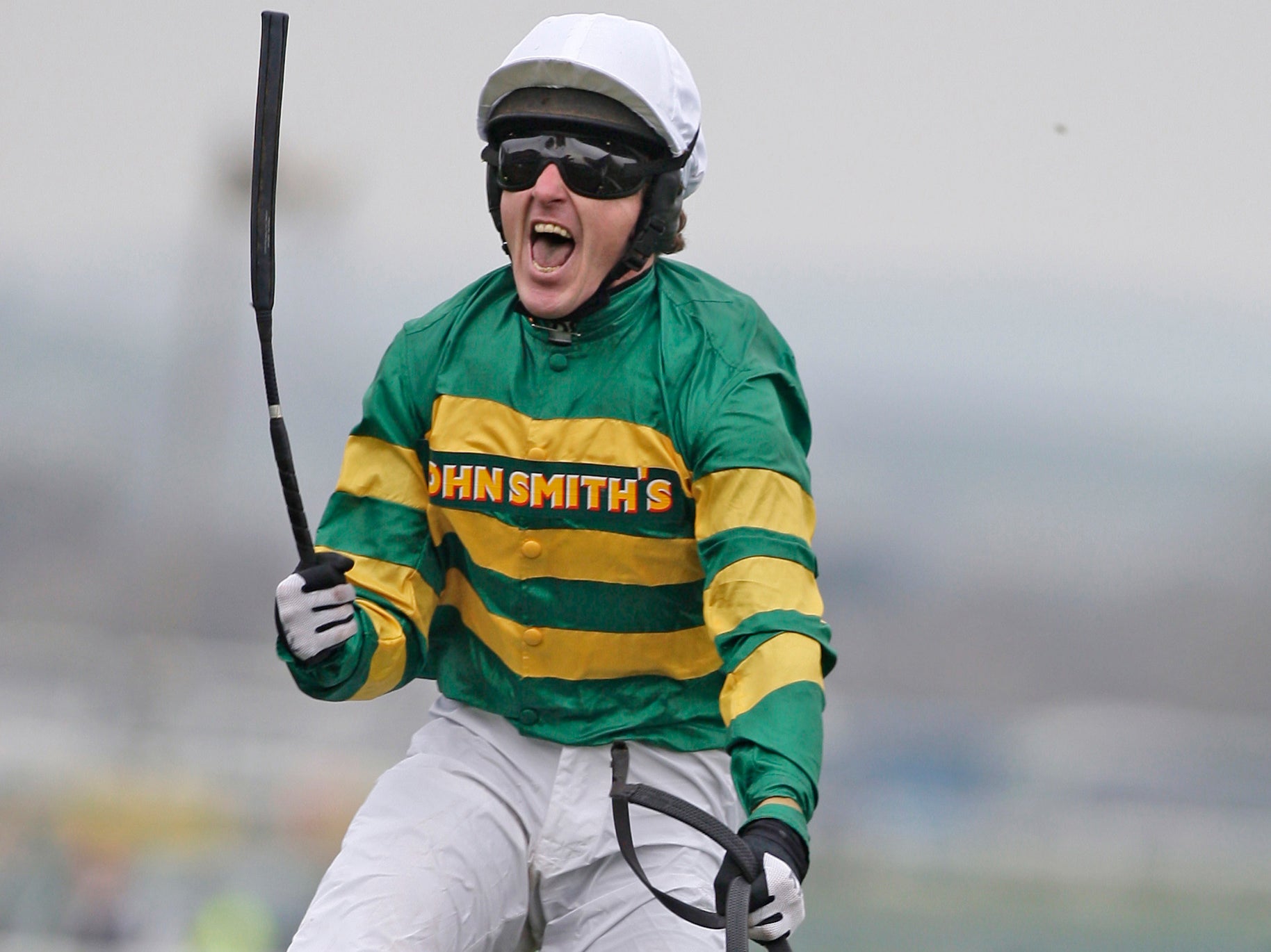 AP McCoy celebrates winning the Grand National in 2010 atop Don’t Push It
