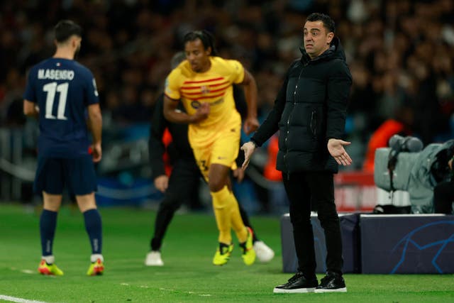 Barcelona head coach Xavi, right, will not change his mind over his decision to quit (Aurelien Morissard/AP/PA)