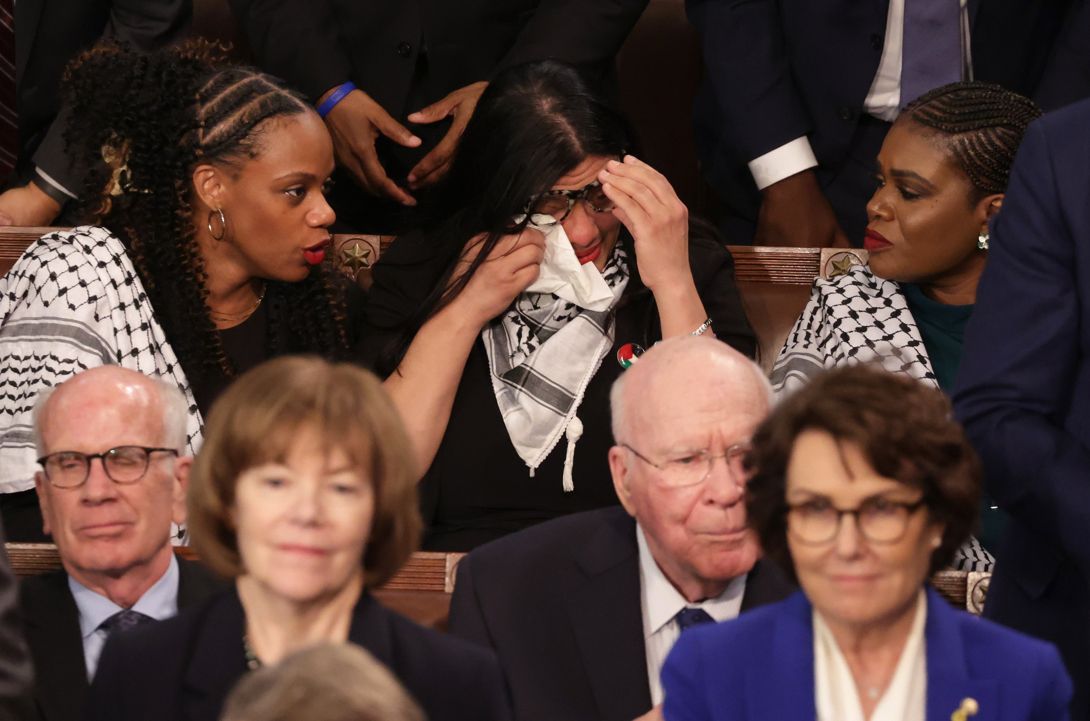 U.S. Rep. Rashida Tlaib (D-MI) wipes her eyes as she listens to President Joe Biden's State of the Union address during a joint meeting of Congress in the House chamber at the U.S. Capitol on March 07, 2024 in Washington, DC. She has vocally criticised Biden’s policy toward Israel. (Photo by Alex Wong/Getty Images)