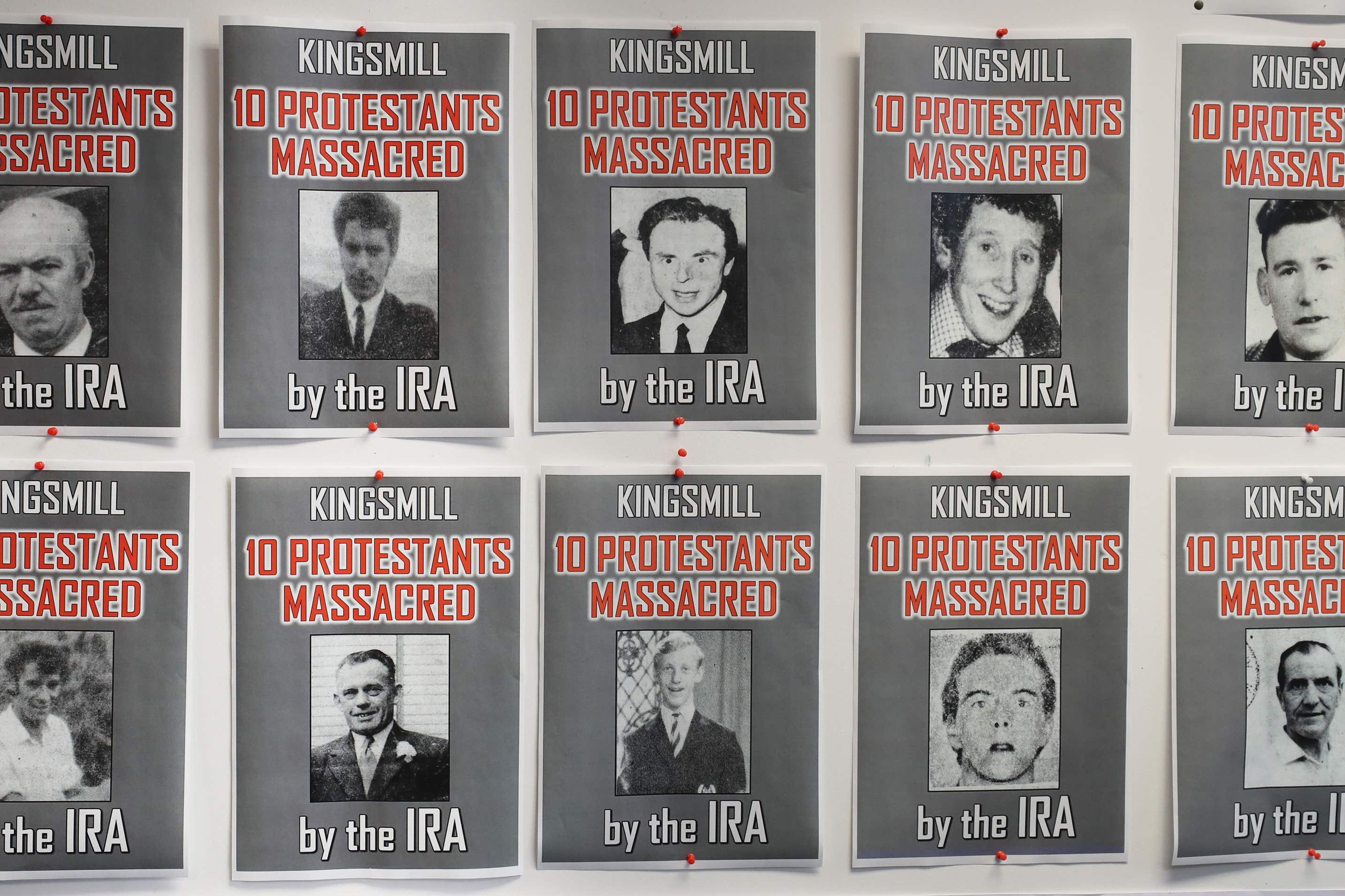 Posters of the ten protestant workmen killed in the Kingsmill massacre in 1976 (Niall Carson/PA)