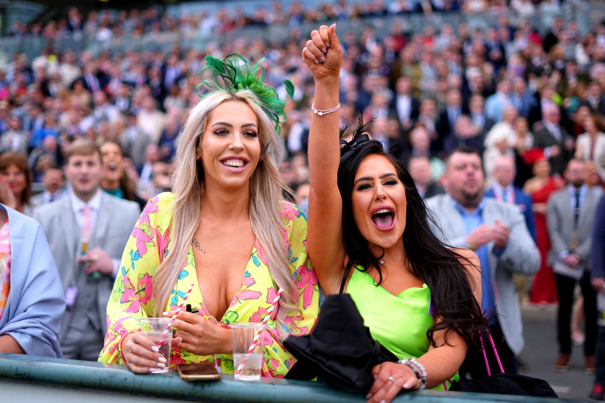 Aintree racegoers enjoy Ladies Day – but fighting breaks out