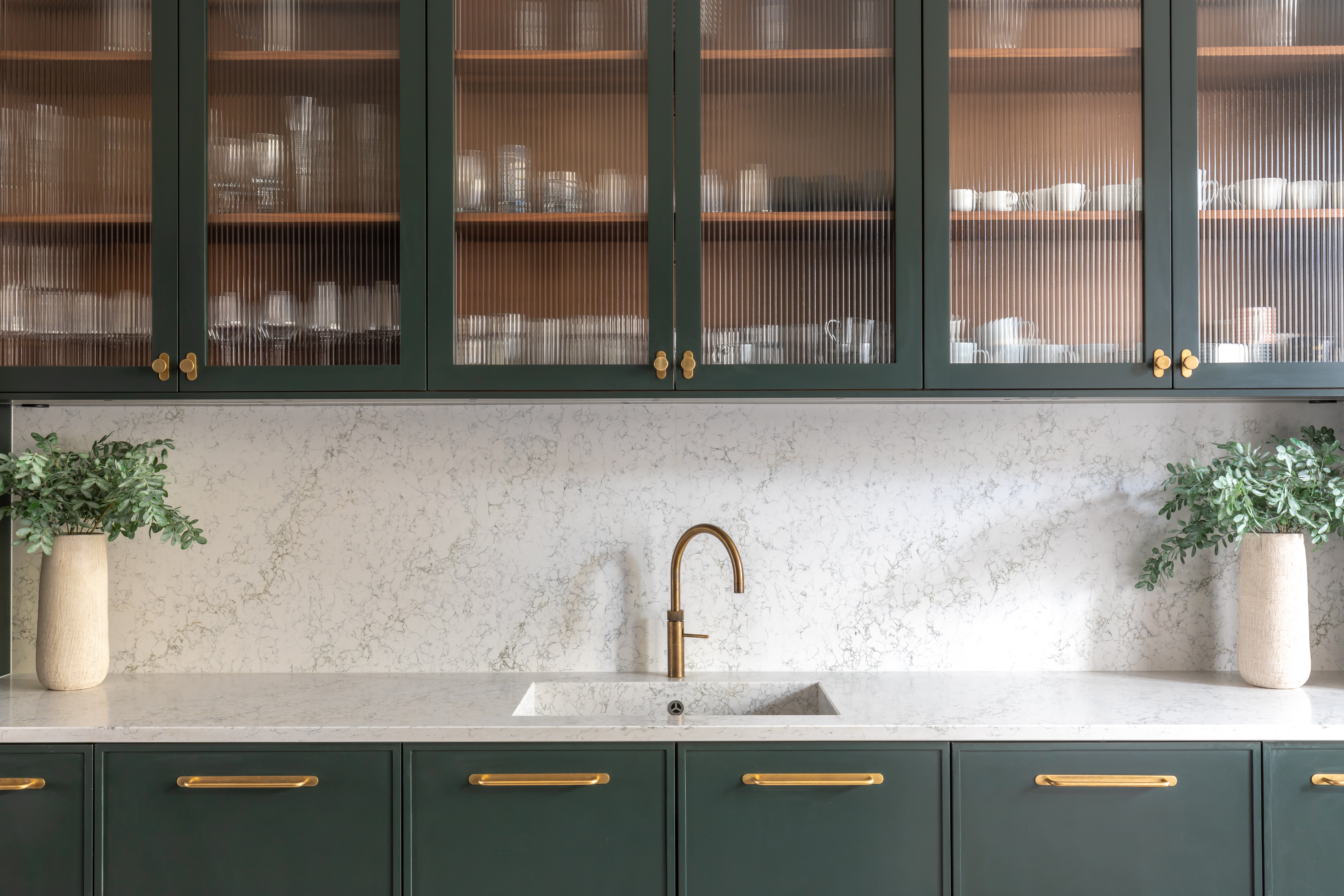 Cabinets with glass display doors will catch the light and open your space