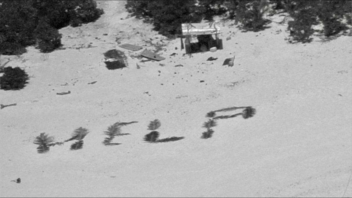 'HELP' sign on beach points rescuers to men stuck nine days on remote Pacific atoll