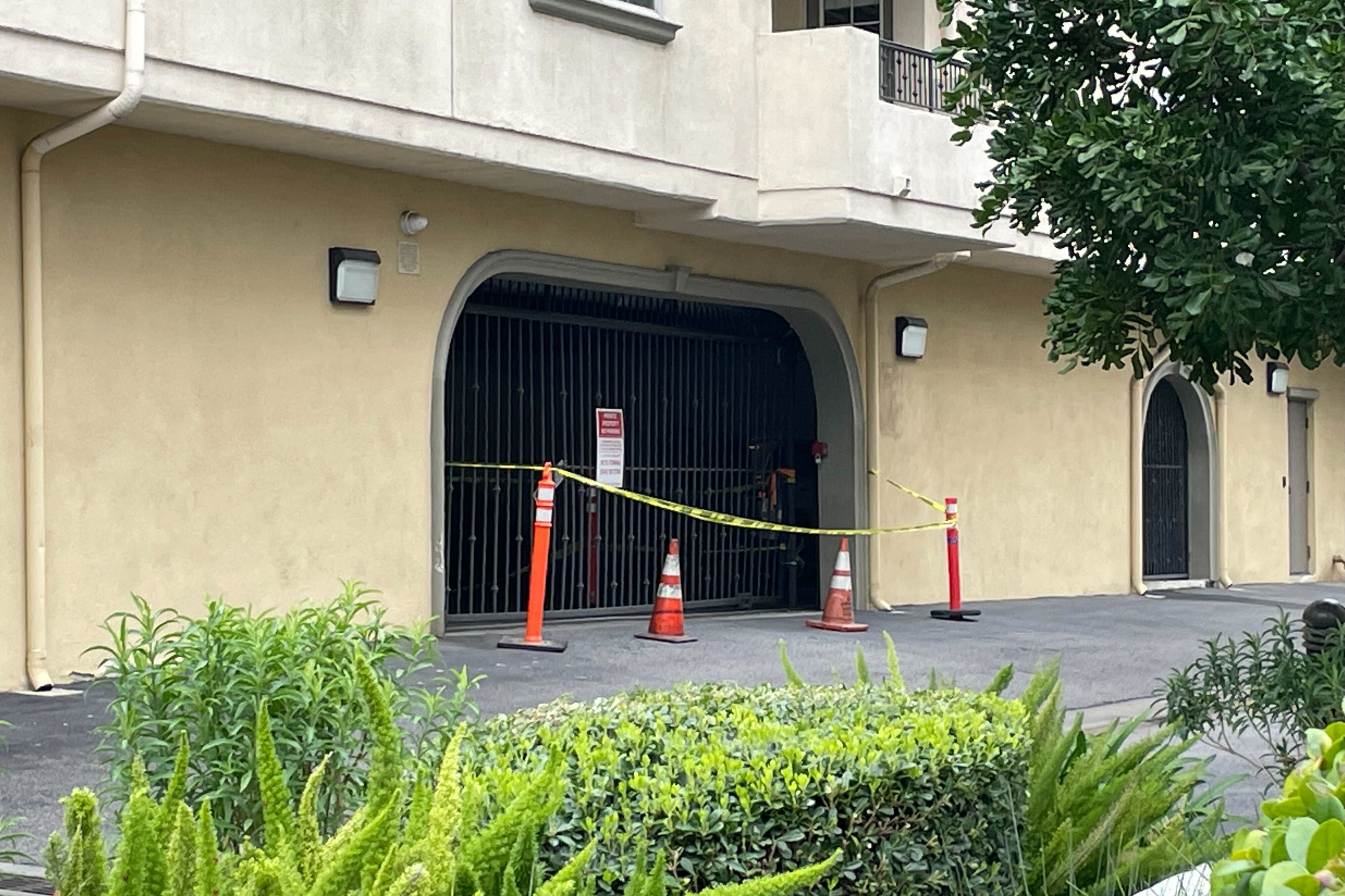 On Friday outside the complex, yellow caution tape was still in place around the gate that Johnson allegedly ploughed through in her Porsche SUV during her escape