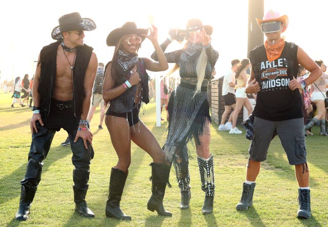<p>Festivalgoers attend the 2024 Coachella Valley Music and Arts Festival on Friday 12 April</p>