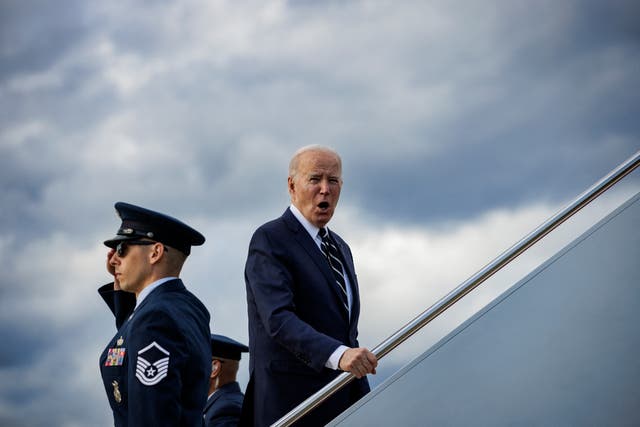 <p>Joe Biden responds to a reporter’s question as he boards Air Force One in Maryland on 12 April </p>