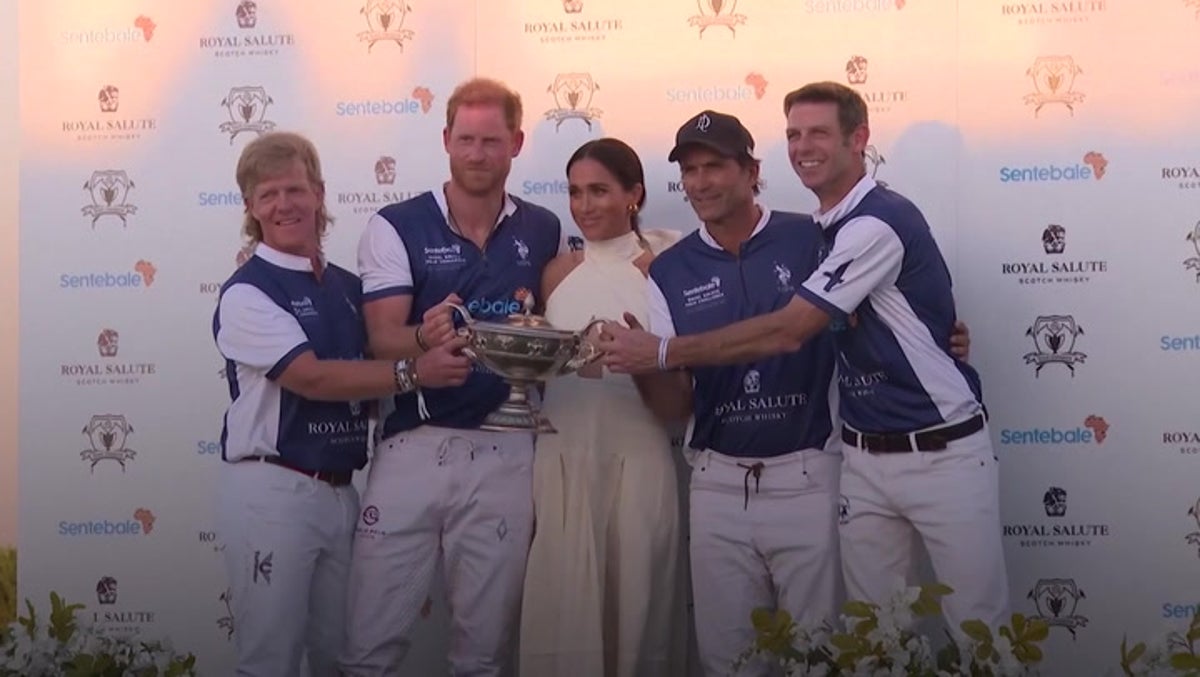 Meghan kisses Harry as she presents him with trophy at Miami charity polo match