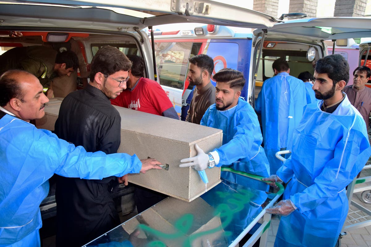 Pakistani police search for gunmen who abducted bus passengers and killed 10 in the southwest