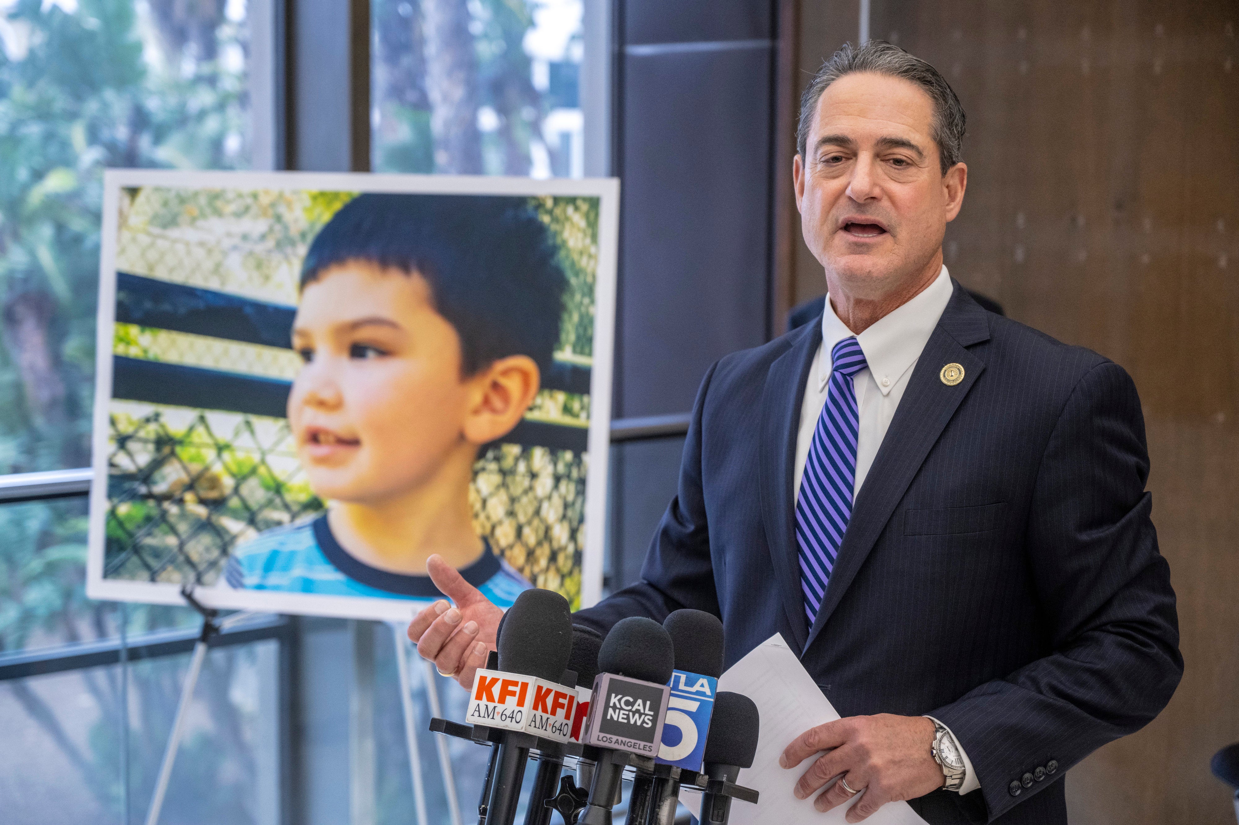 Orange County District Attorney Todd Spitzer, pictured with a portrait of Aiden Leos, praised Eriz’s maximum sentence on Friday