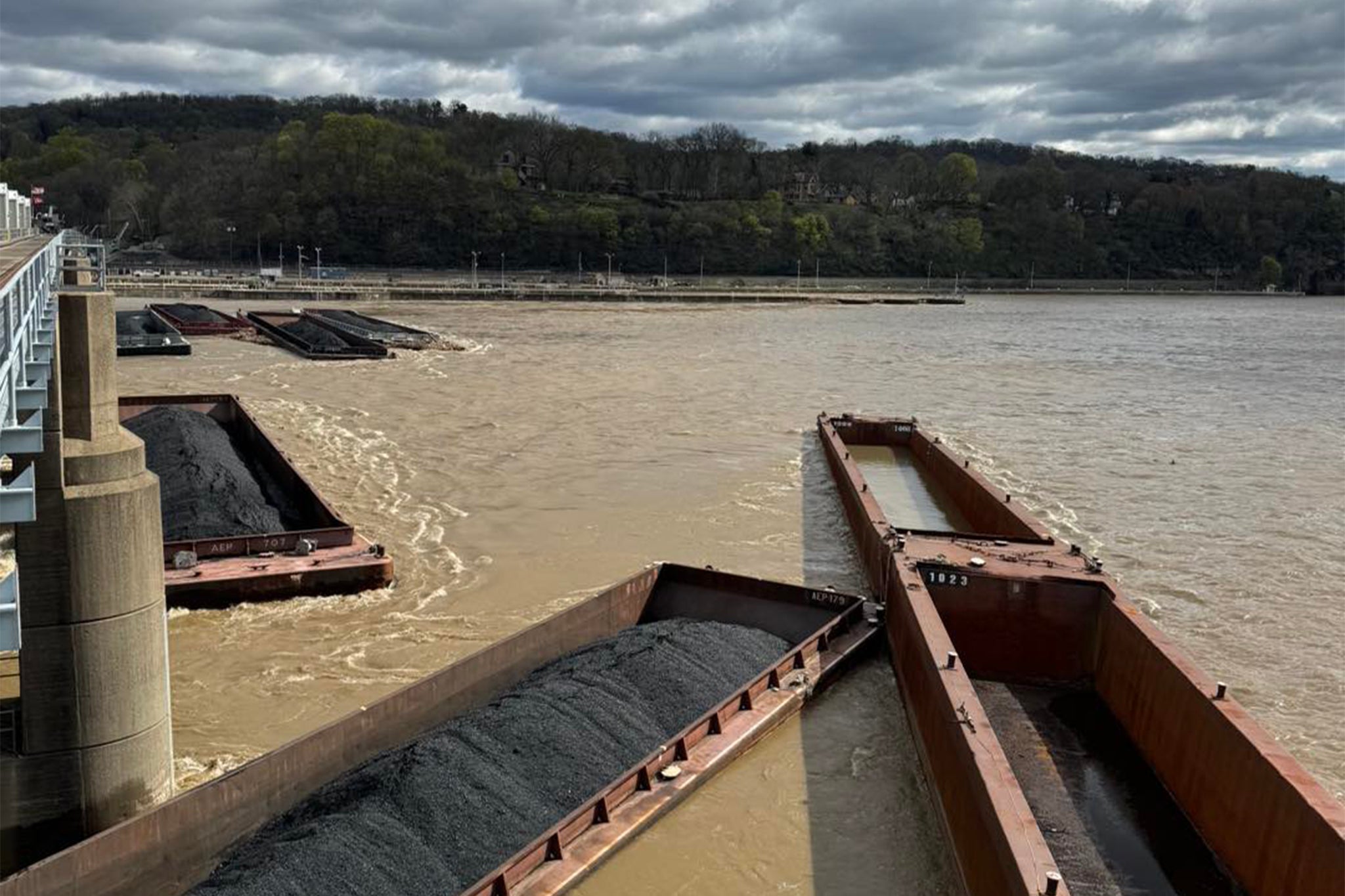 26 barges, several of which are pictured, broke loose in the Ohio River near Pittsburgh, Pennsylvania late Friday evening