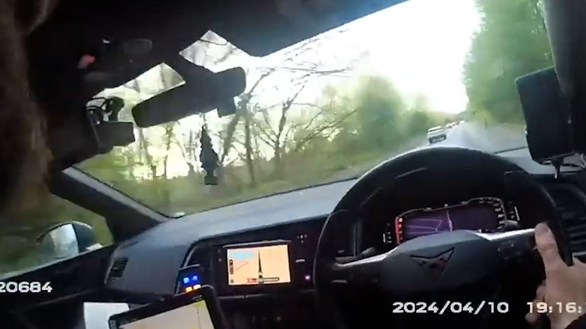 Speeding driver reverses wrong way at 60mph before he is caught by police officer – on a bike