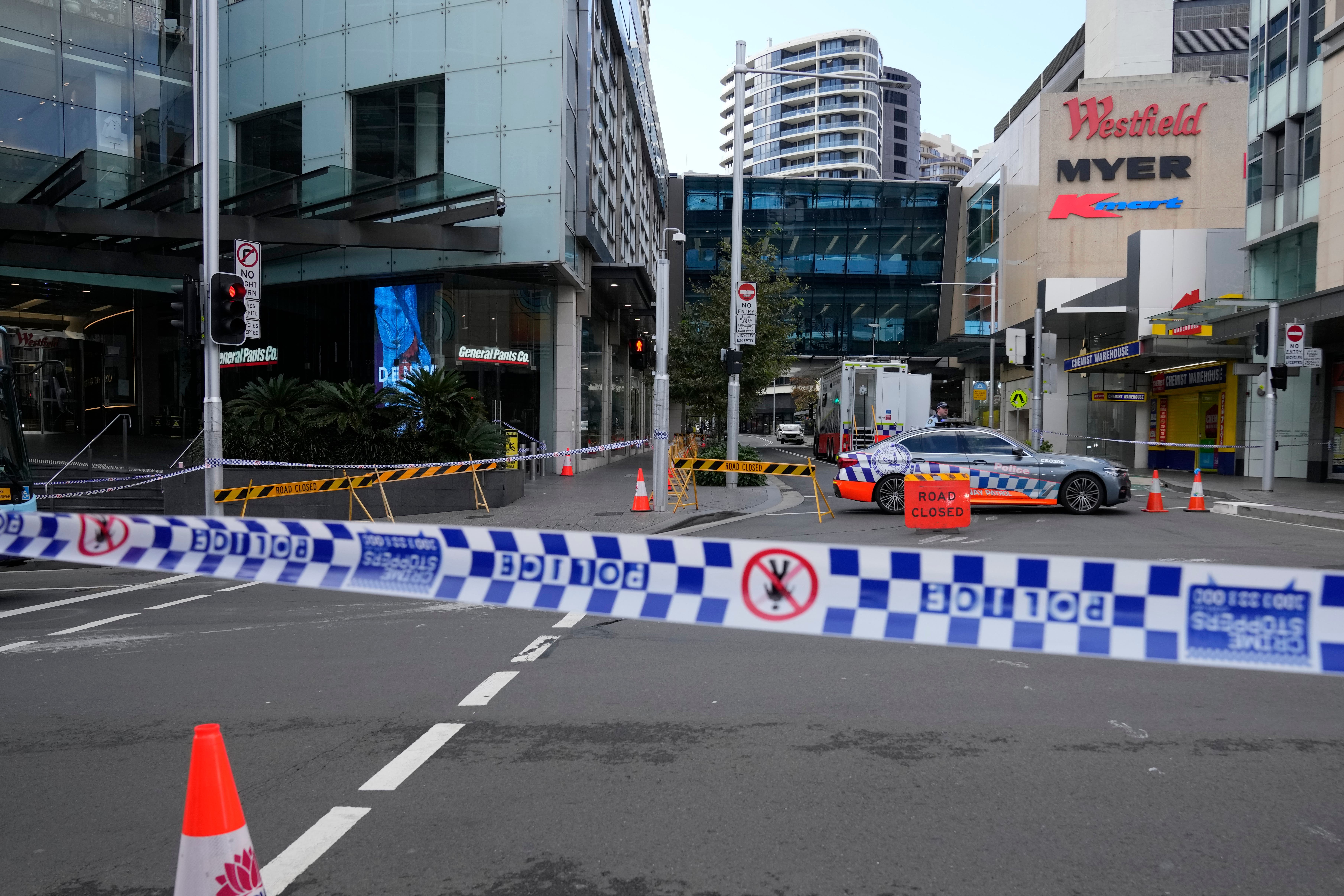 Police block a street near a crime scene at Bondi Junction in Sydney (Rick Rycroft/AP)