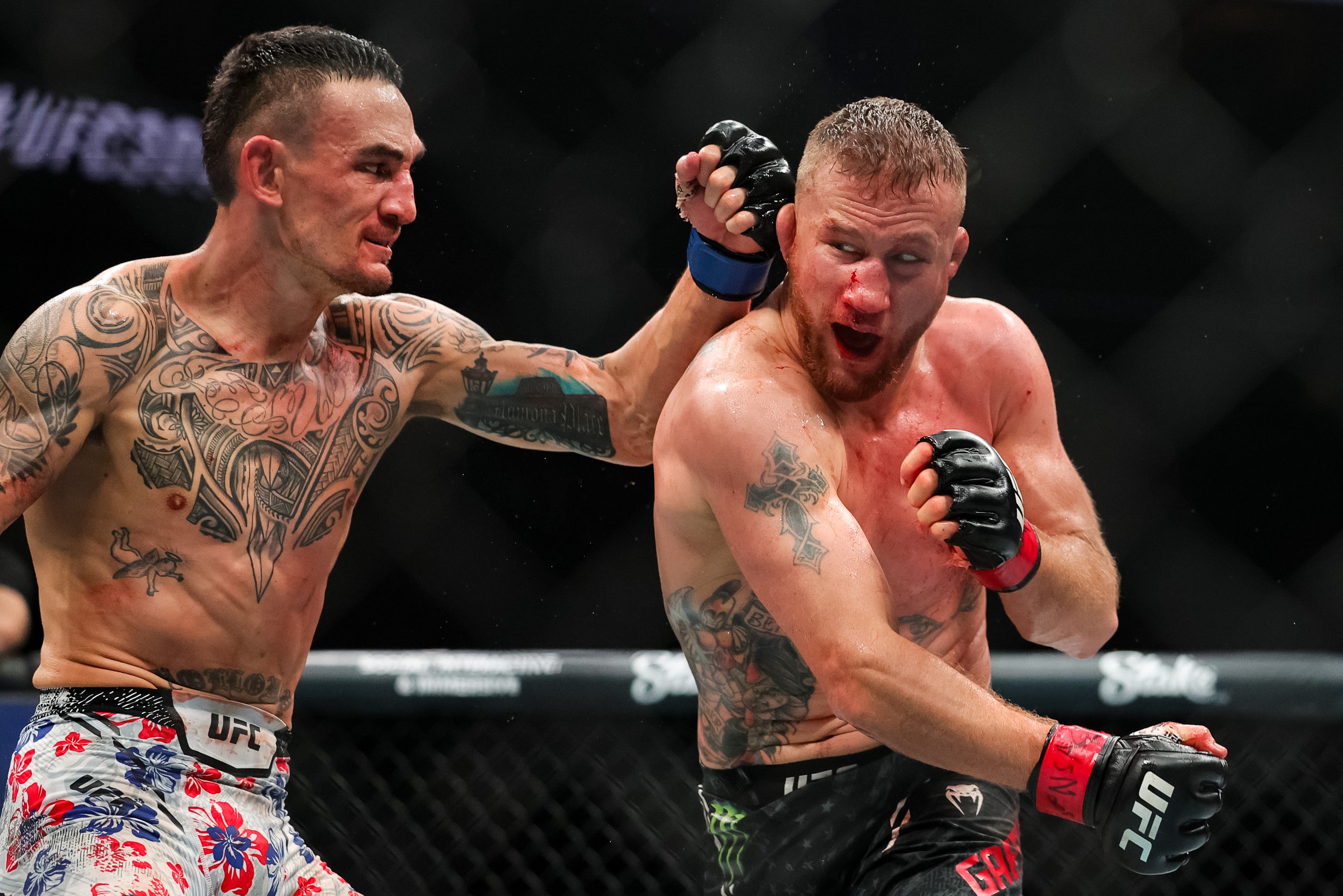 Holloway (left) knocked out Gaethje in the final second of their five-round fight