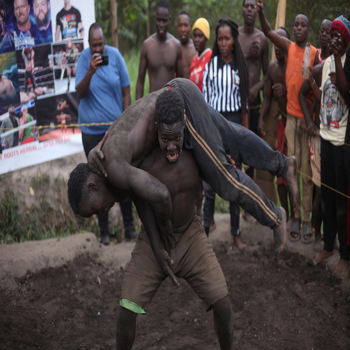 Young Ugandans tangle in the mud. They dream of becoming professional  wrestlers | The Independent