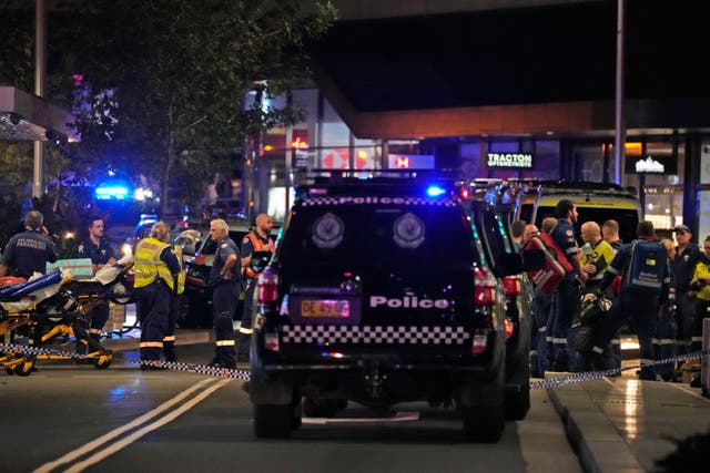 Emergency officers outside Westfield Shopping Centre in Sydney (Rick Rycroft/PA)