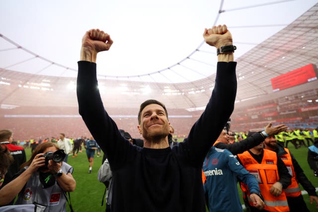 <p>Xabi Alonso celebrates as Bayer Leverkusen were crowned Bundesliga champions </p>